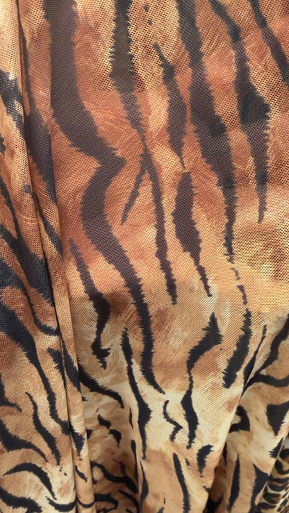 Exotic Tiger and Leopard design print on great quality of power mesh 4-way stretch 58/60” Sold by the YD. Ships Worldwide from Los Angeles