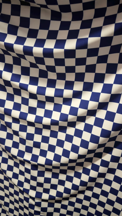 Sapphire/White Checkered design 1" print on nylon spandex 4way stretch 58/60" Sold by the YD. Ships worldwide from Los Angeles California