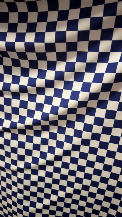Sapphire/White Checkered design 1" print on nylon spandex 4way stretch 58/60" Sold by the YD. Ships worldwide from Los Angeles California