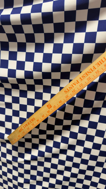 Sapphire/White Checkered design 1" print on nylon spandex 4way stretch 58/60" Sold by the YD. Ships worldwide from Los Angeles California