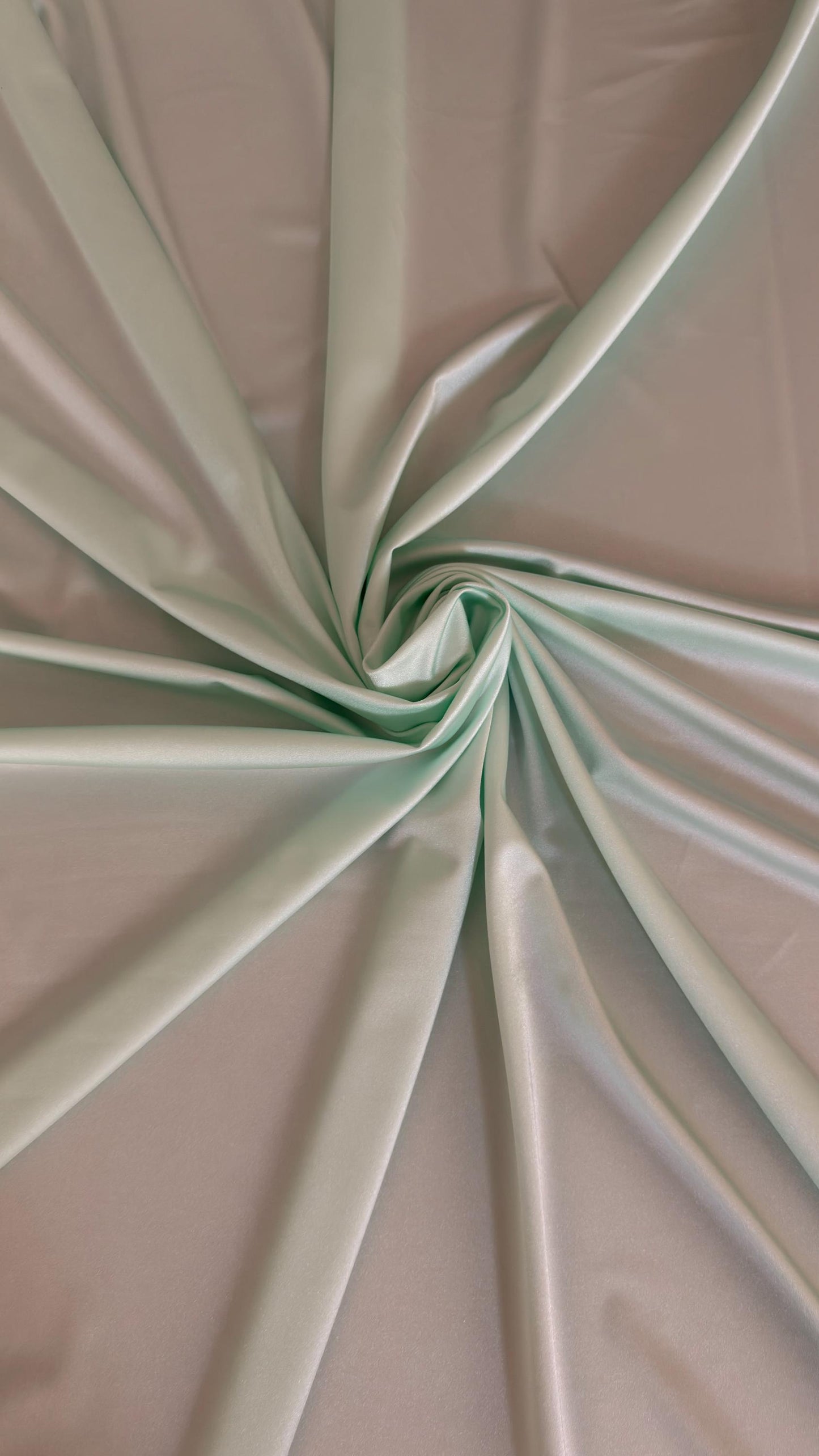 Great quality shiny Soft Mint color nylon spandex 4-way stretch 58/60” Sold by the YD. Ships worldwide from Los Ángeles California USA.