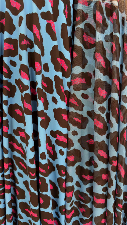 Exotic Leopard design Turquoise/Pink print on nylon spandex and power mesh nylon spandex  4-way stretch Green /black 58/60” Sold by the YD.