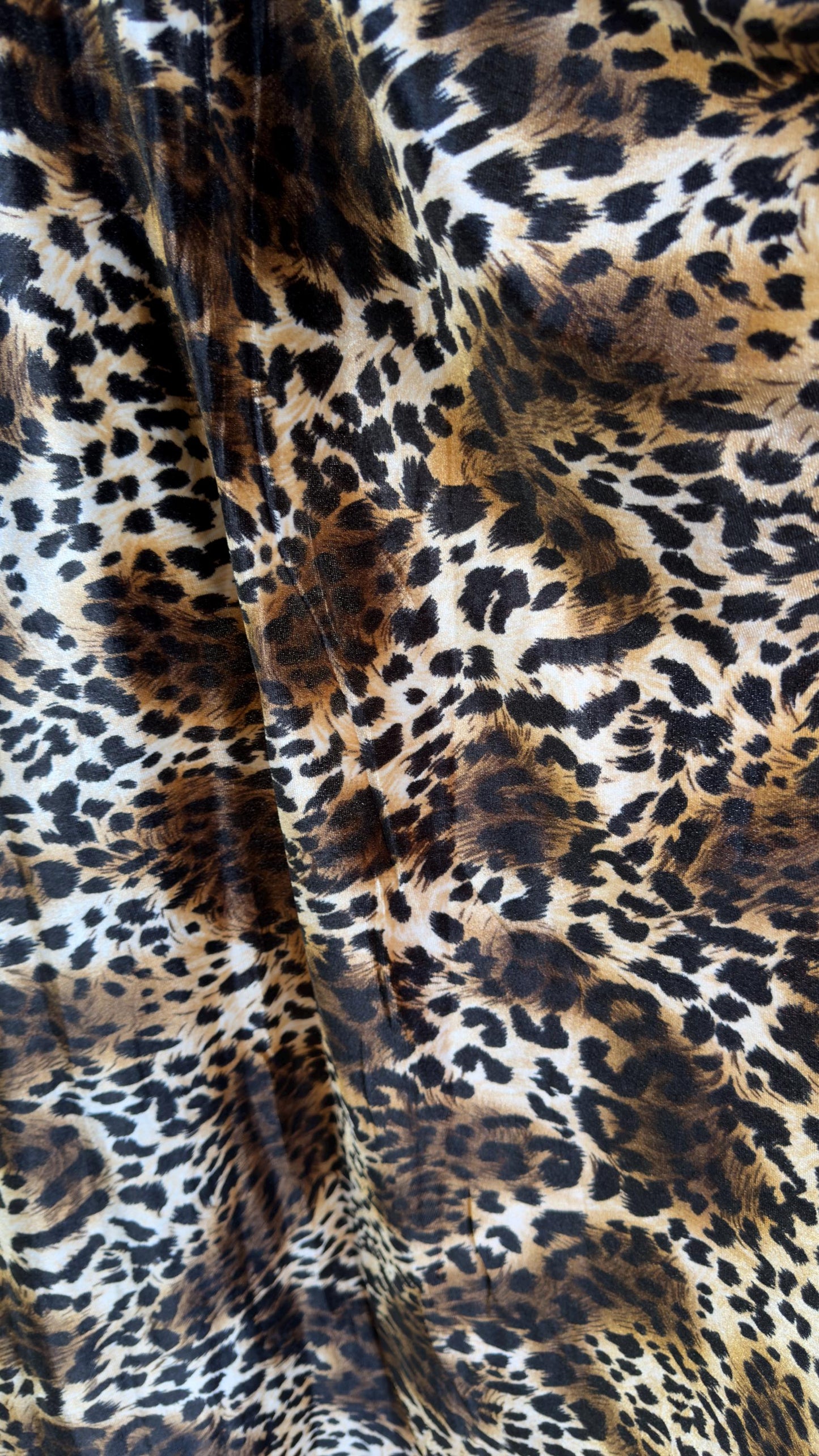 New Leopard print Brown/Black on heavy stretch velvet 4way stretch 58/60" Sold by the YD. Ships worldwide from Los Ángeles California USA.