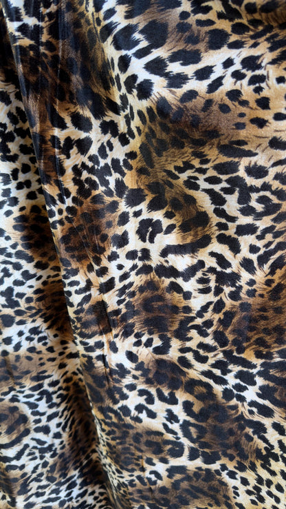 New Leopard print Brown/Black on heavy stretch velvet 4way stretch 58/60" Sold by the YD. Ships worldwide from Los Ángeles California USA.