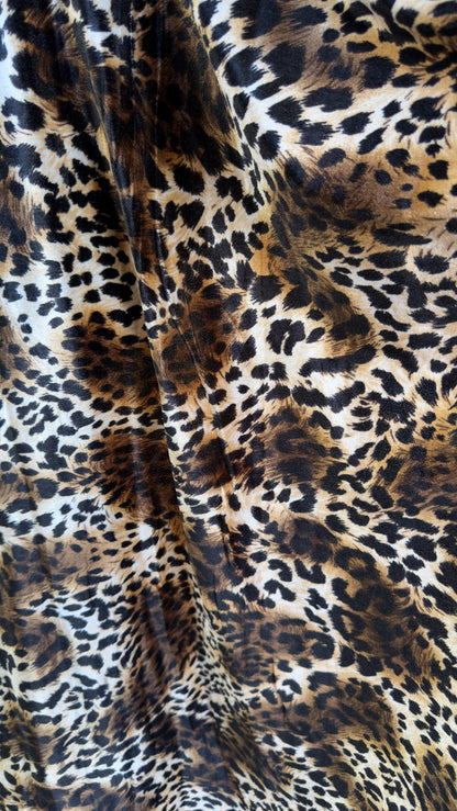 New Leopard print Brown/Black on heavy stretch velvet 4way stretch 58/60" Sold by the YD. Ships worldwide from Los Ángeles California USA.