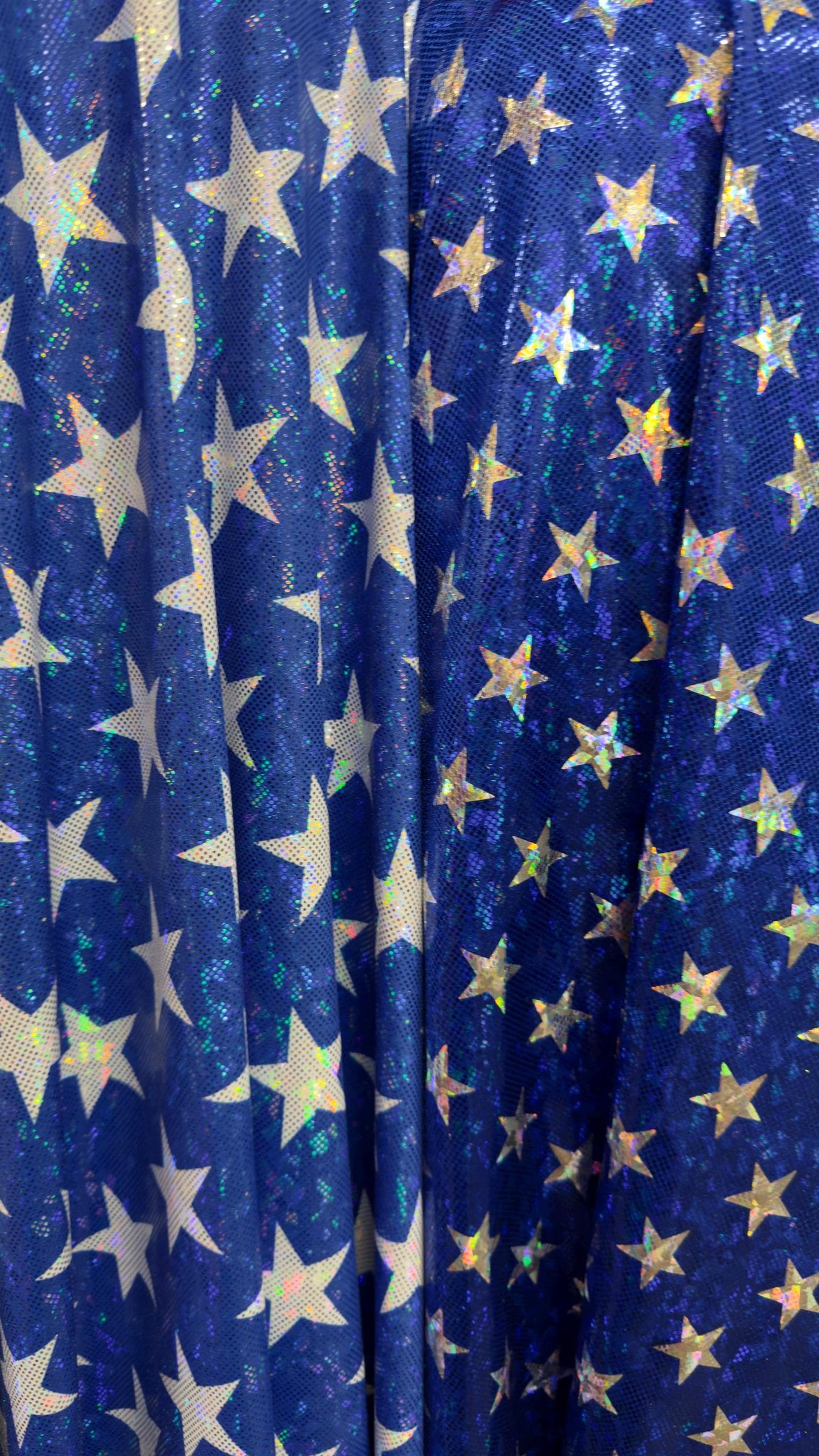 Stars Freedom design 2 sizes on metallic shattered glass hologram nylon spandex 4-way stretch 58/60” Multicolor Sold by the YD.