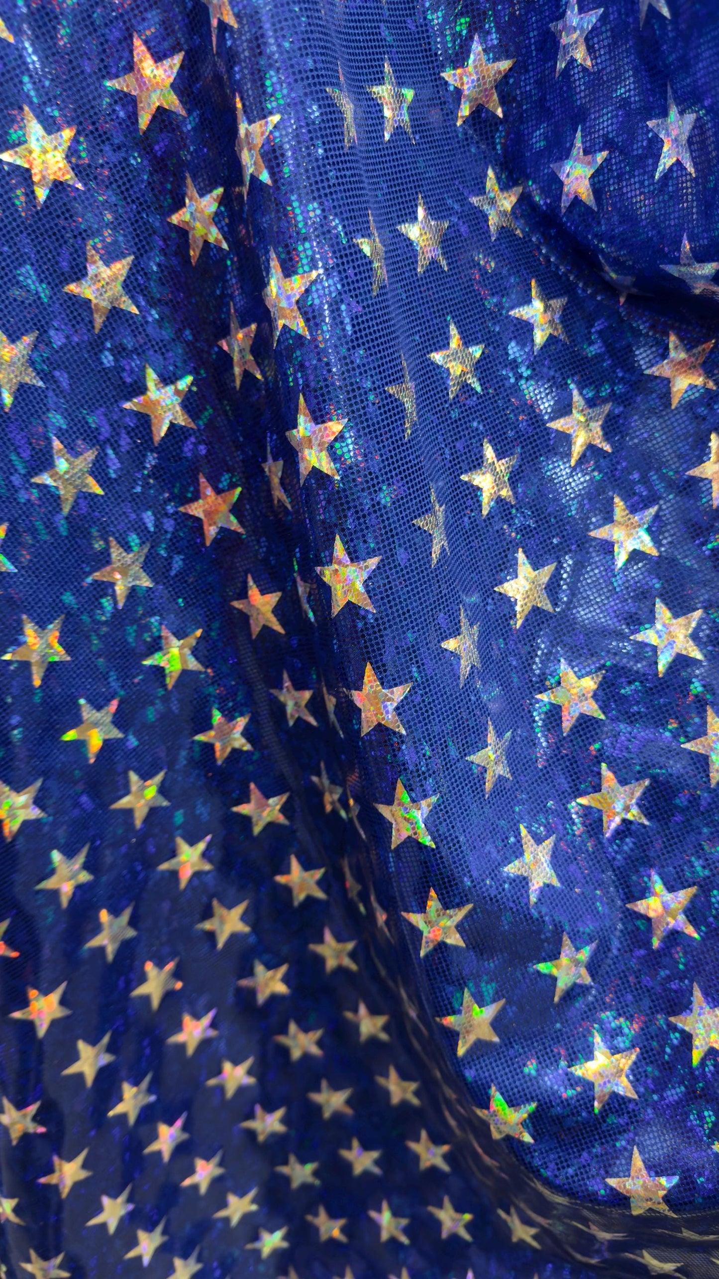 Stars Freedom design 2 sizes on metallic shattered glass hologram nylon spandex 4-way stretch 58/60” Multicolor Sold by the YD.