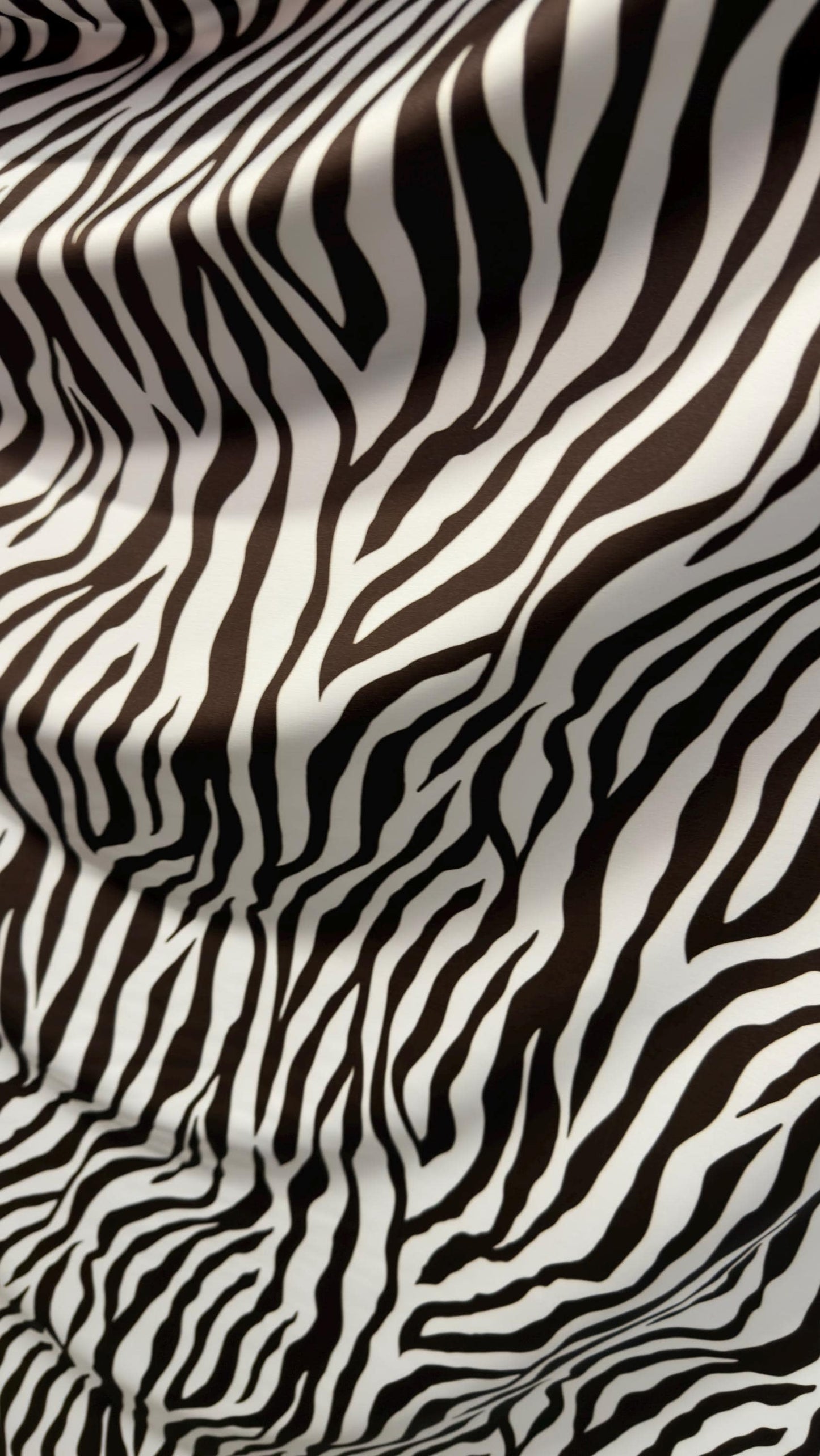 New exotic Brown zebra design print on nylon spandex 4-way Stretch 58/60” Sold by the YD. Ships worldwide from Los Angeles California USA.