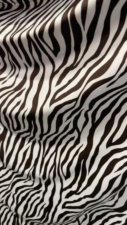 New exotic Brown zebra design print on nylon spandex 4-way Stretch 58/60” Sold by the YD. Ships worldwide from Los Angeles California USA.