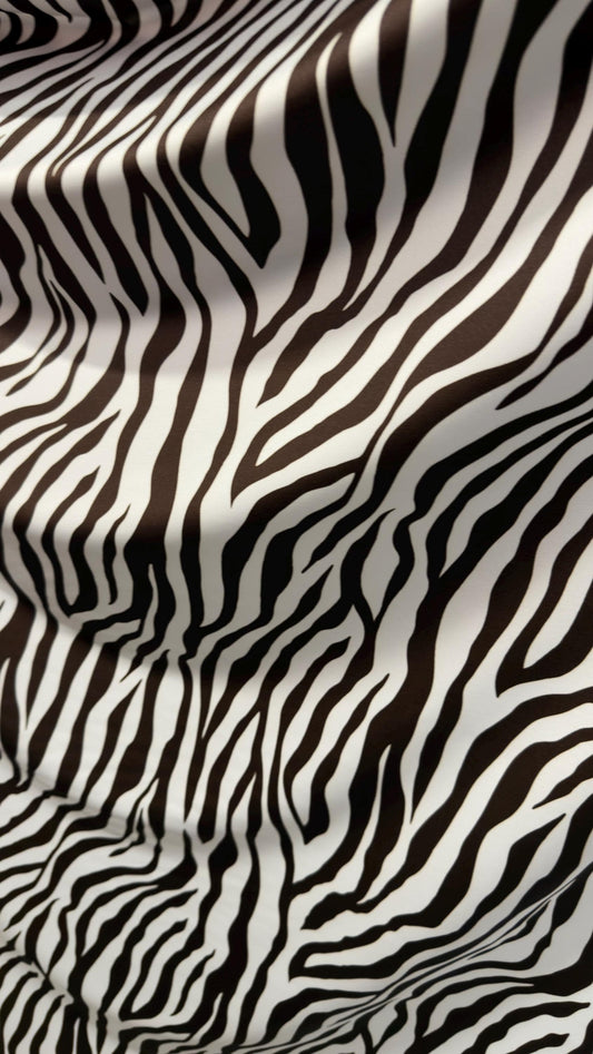 New exotic Brown zebra design print on nylon spandex 4-way Stretch 58/60” Sold by the YD. Ships worldwide from Los Angeles California USA.