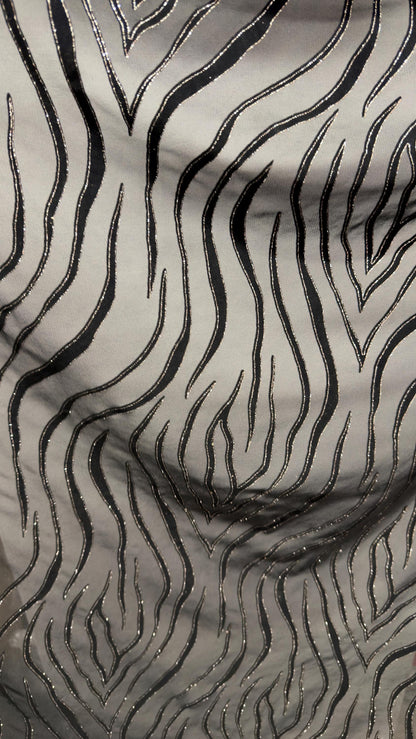 Exotic Tiger design on stretch mesh nylon spandex with flocking 4-way stretch 58/60” Sold by the YD. Ships Worldwide from Los Angeles CA USA