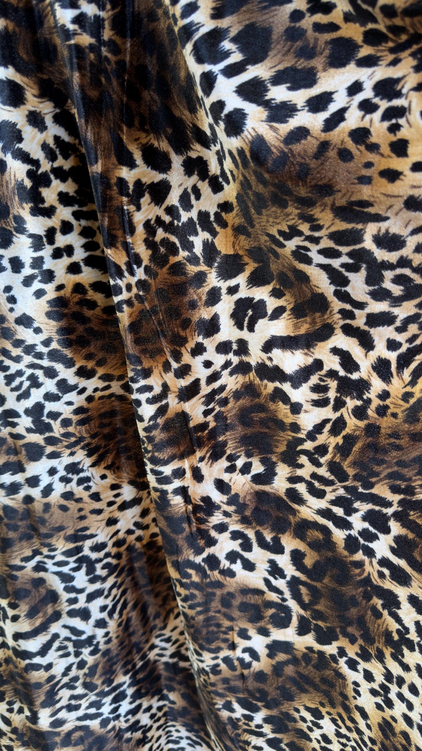 New Leopard print Brown/Black on heavy stretch velvet 4way stretch 58/60" Sold by the YD. Ships worldwide from Los Ángeles California USA.