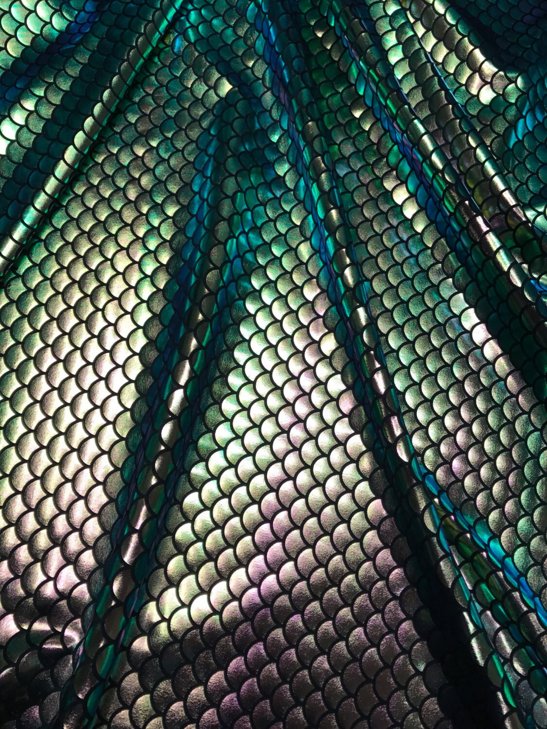 Iridescent green mermaid fish scale design. Spandex Fabric 4way. Sold by the yd.  60" inches