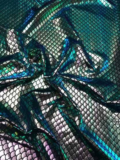 Iridescent green mermaid fish scale design. Spandex Fabric 4way. Sold by the yd.  60" inches