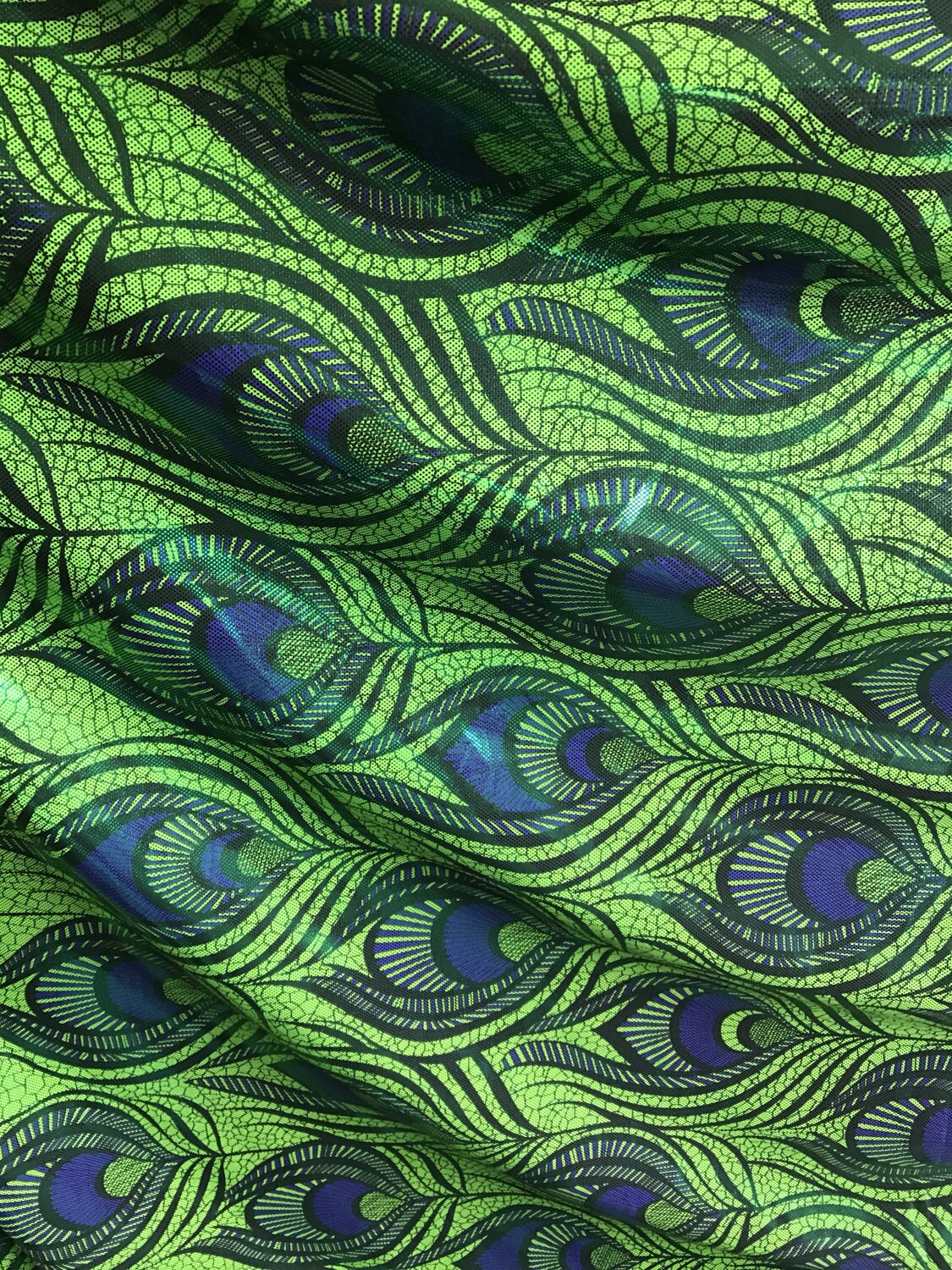 Green peacock feather design nylon spandex 4 way stretch 58/60" Sold by the yd. Ships worldwide from Los Angeles California USA