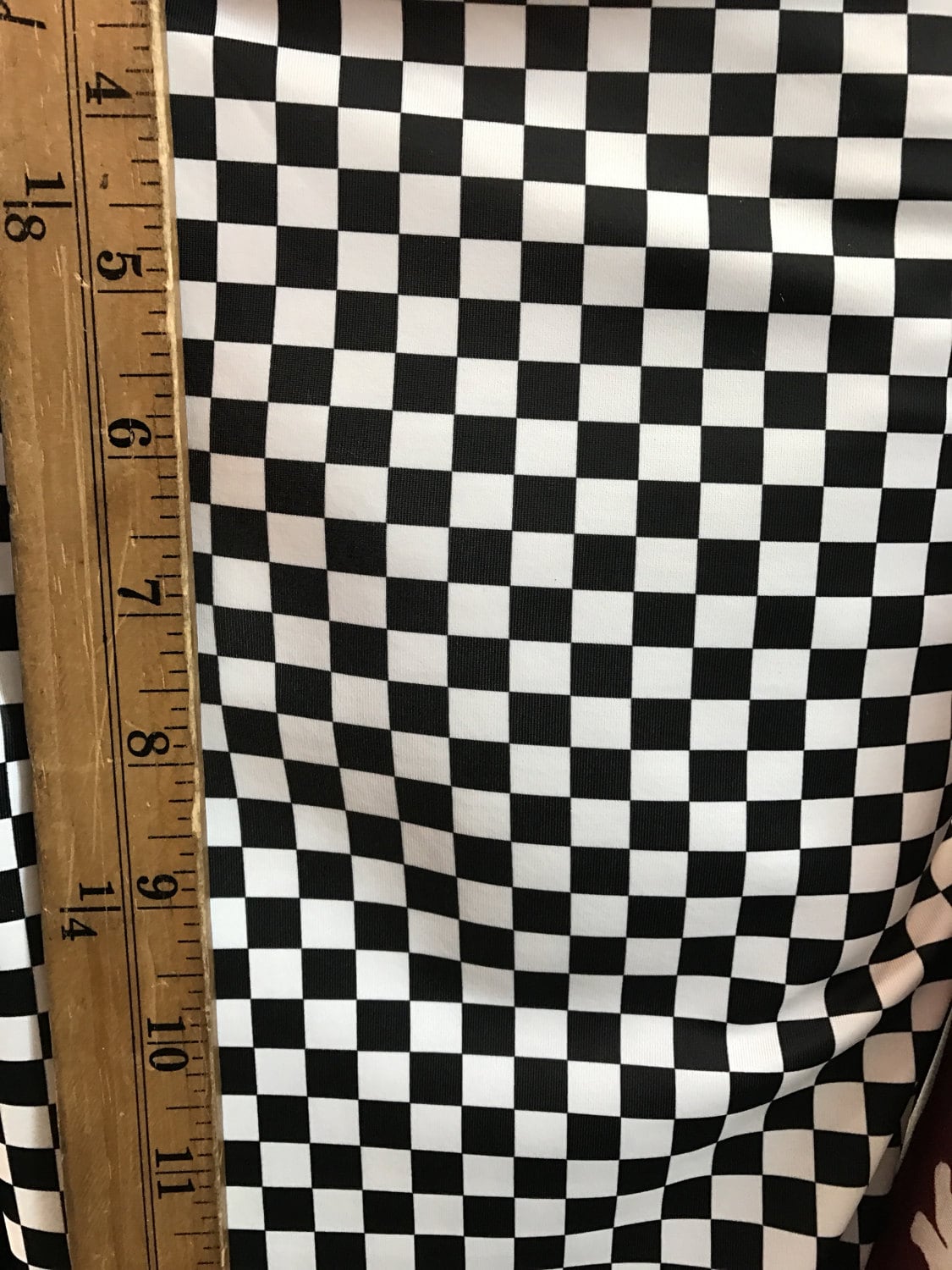 Small checkered pattern on nylon spandex 4way strexh 58/60" sold by the yd. Ships worldwide from Los Angeles California USA