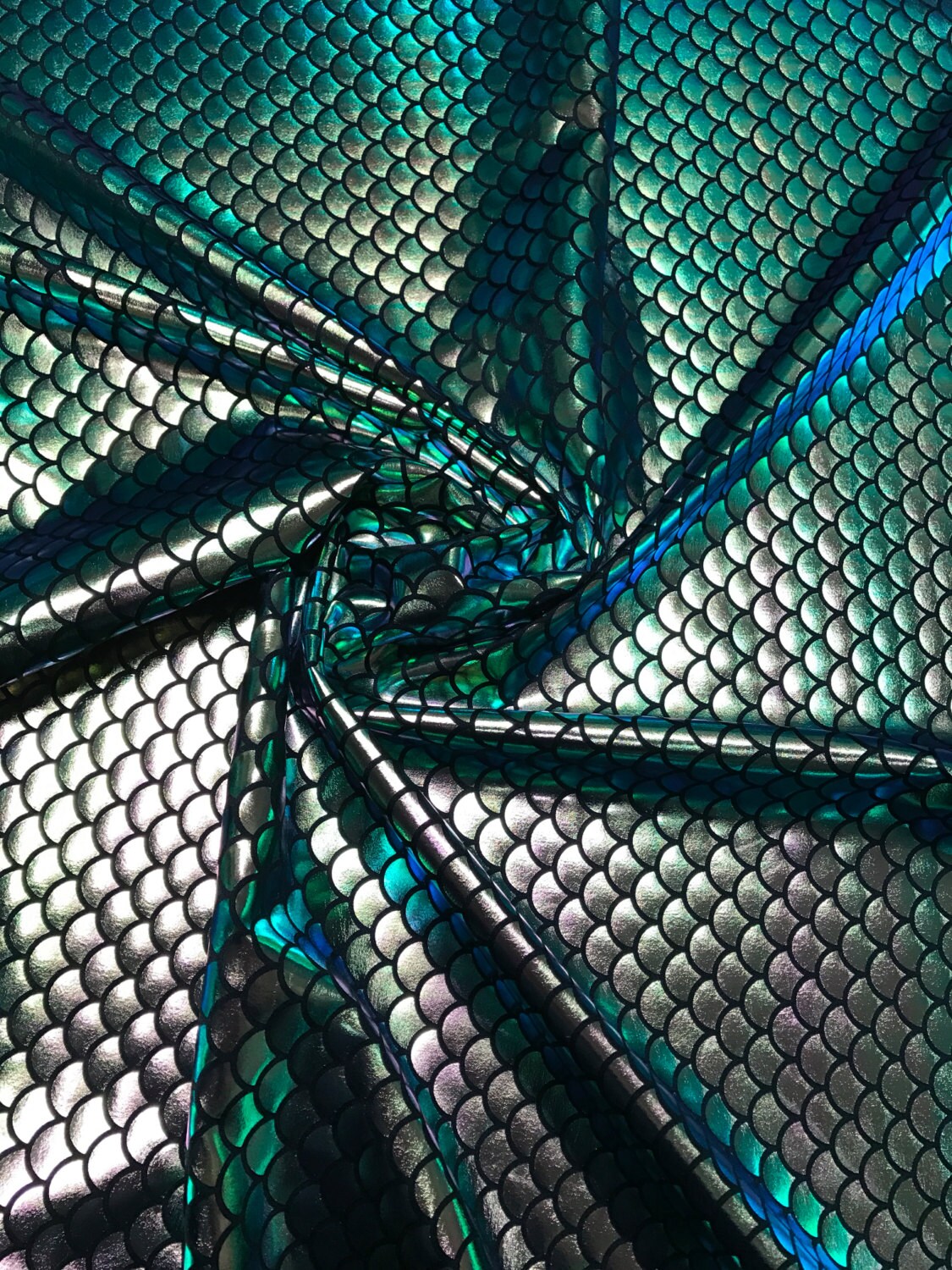 Iridescent green mermaid fish scale design. Spandex Fabric 4way. Sold by the yd.  60" inches