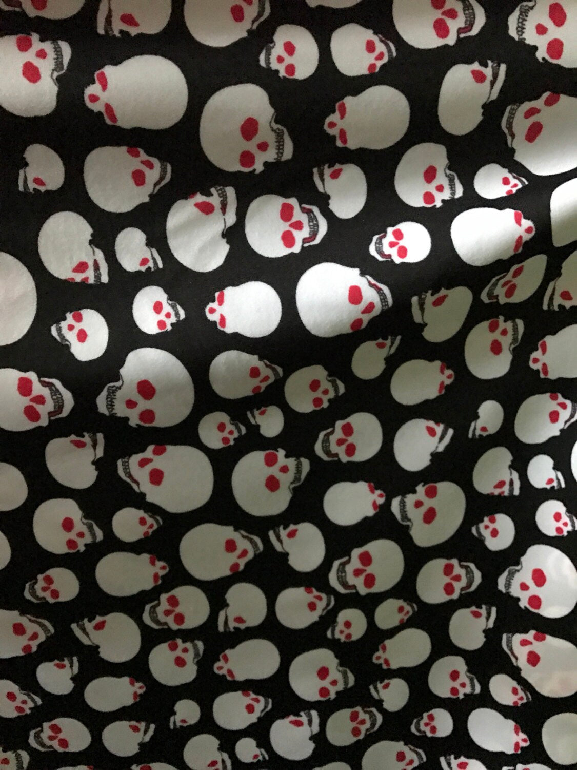 Skull design on nylon spandex 4way stretch 58/60" sold by the yd. Ships worldwide from Los Angeles California USA.