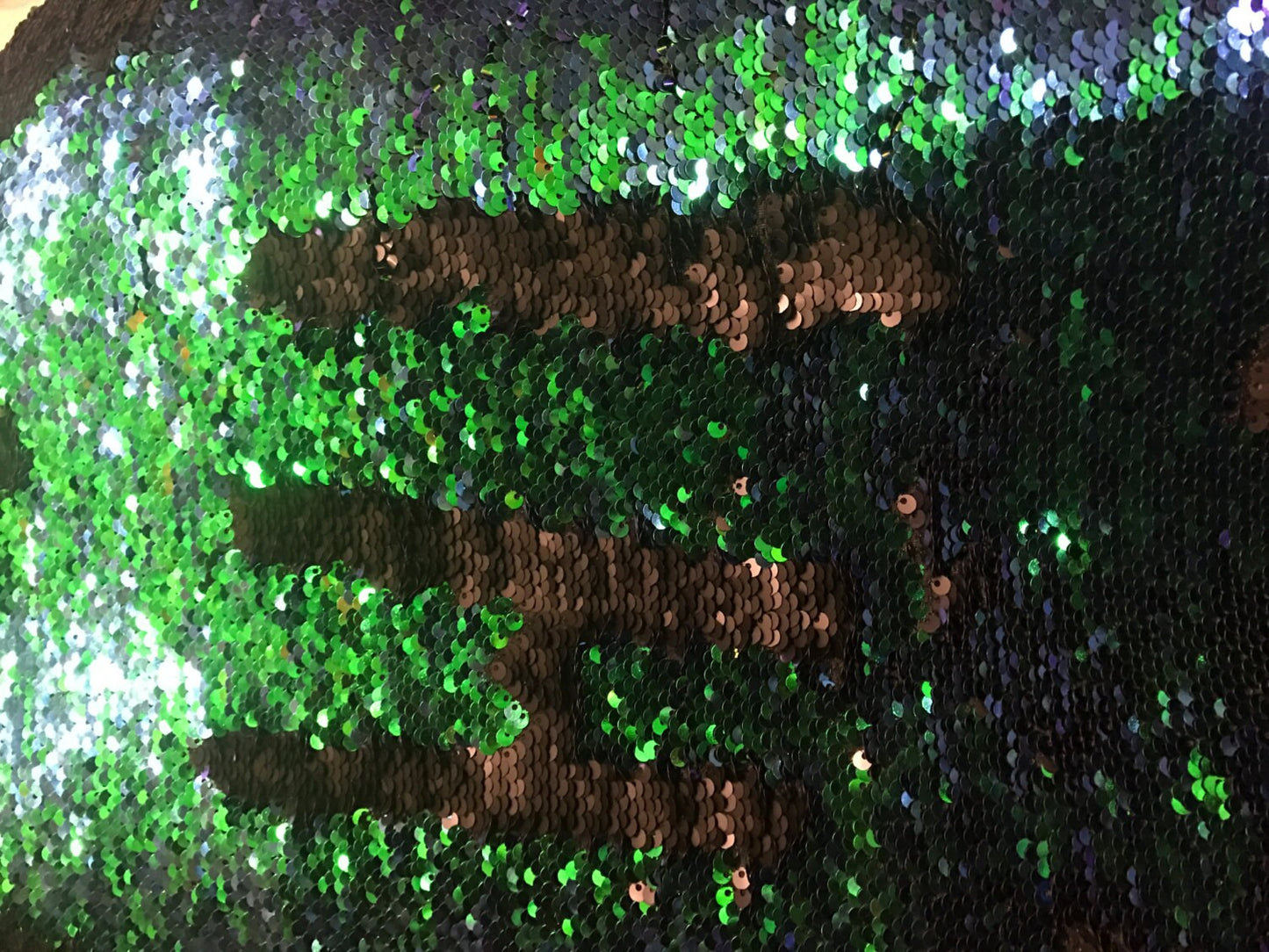 Mermaid green flip up sequins sold by the full roll 58/60" with spandex base. Ships worldwide from Los Angeles California USA