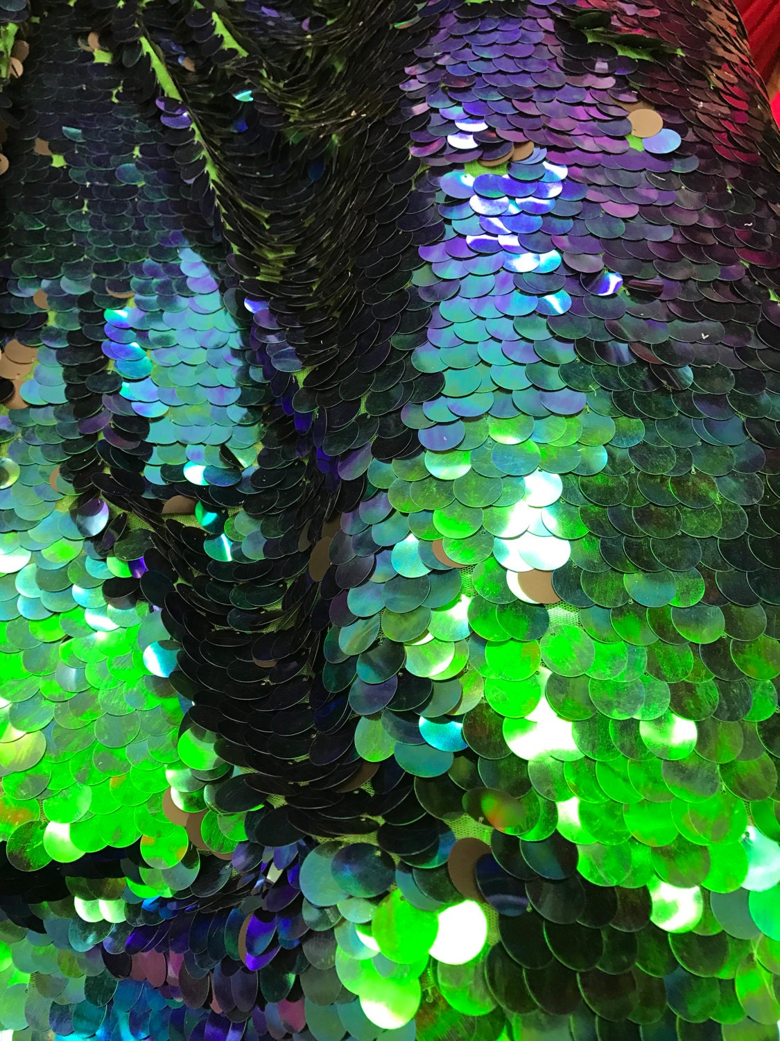 Iridescent mermaid green big paillette sequins on stretch mesh base 2way 58/60"  Sold by the YD. Ships worldwide from Los Angeles California