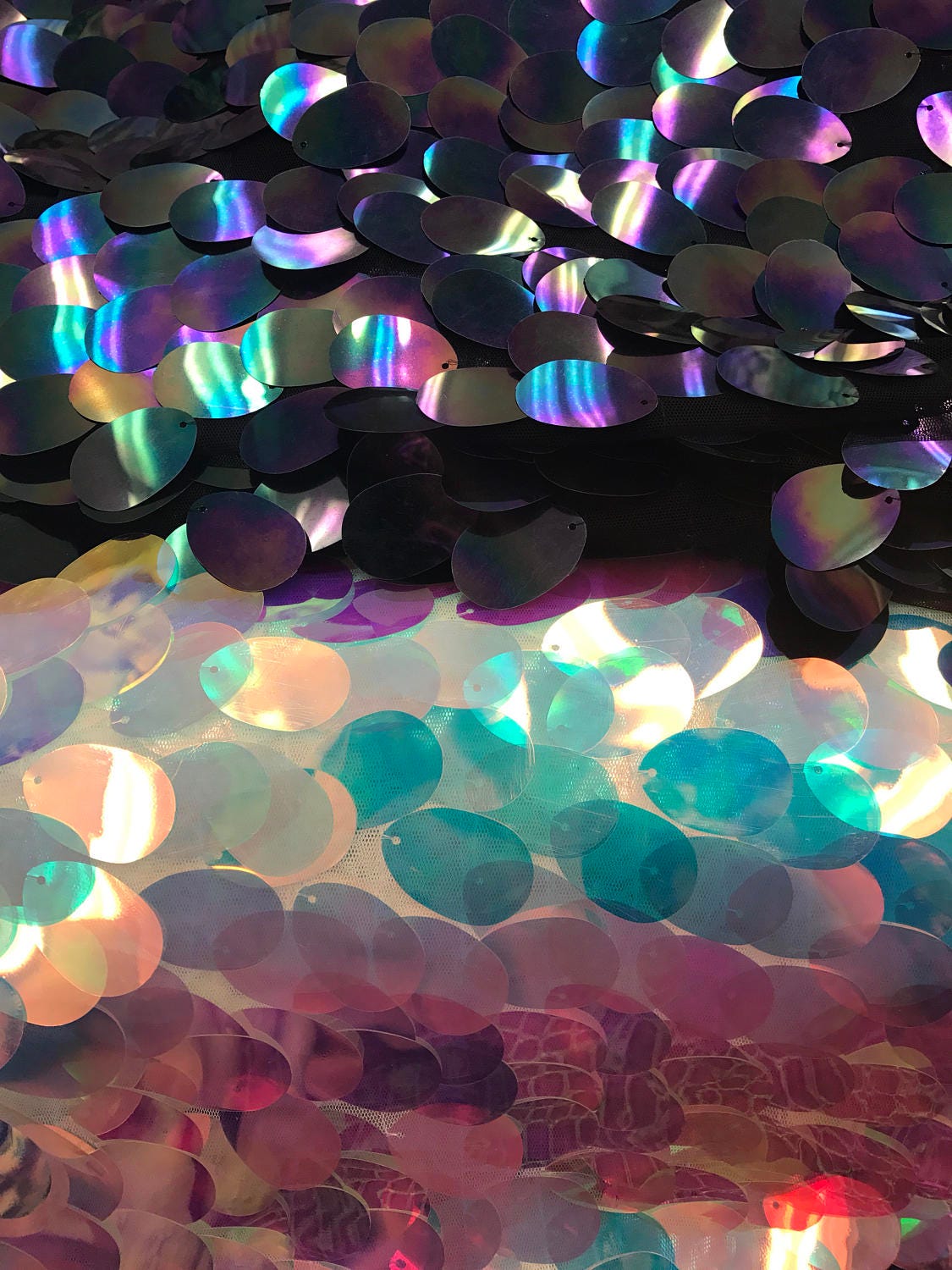 NEW iridescent jumbo size tear drop sequins on stretch mesh base 2 way stretch 56/57" Sold by the YD. Ships worldwide from Los Angeles CA