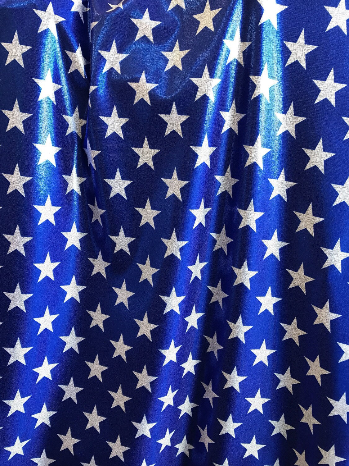 BIG STAR blue/white foggy foil design on nylon spandex 4way stretch 58/60" sold by the yd. Ships worldwide from Los Angeles California USA