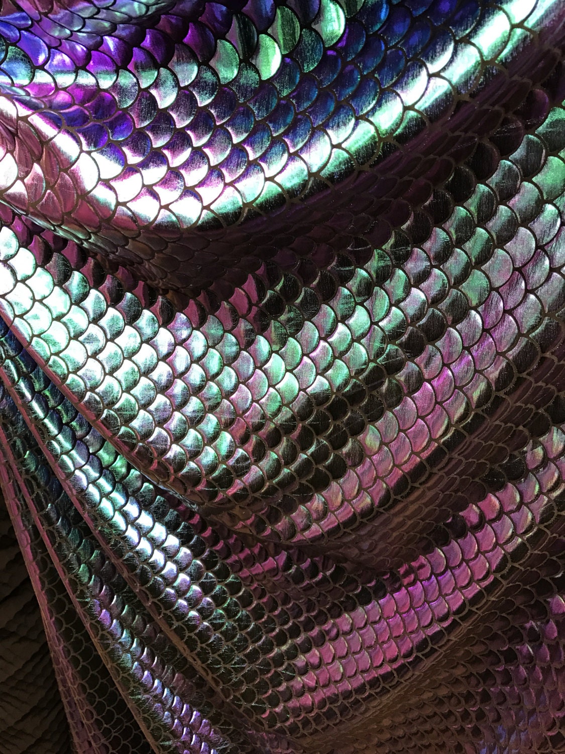 Iridescent sirena design 2tone foil medium size 4 way stretch base 58/60" Sold by the yd. Ships worldwide from Los Angeles California USA