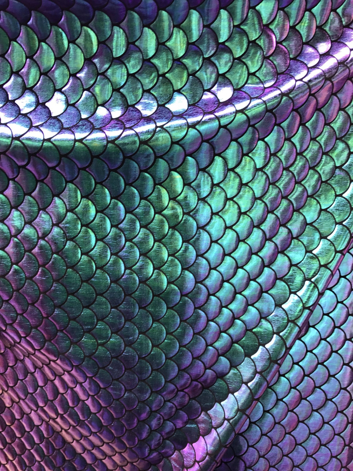 Iridescent sirena design 2tone foil medium size 4 way stretch base 58/60" Sold by the yd. Ships worldwide from Los Angeles California USA