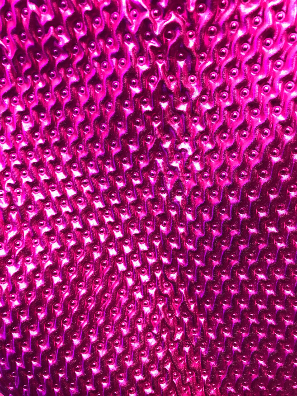 Quilted foil 2way stretch,  fuschia all over foil 58/60" Sold by the YD. Ships worldwide from Los Angeles California USA.