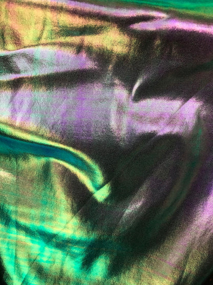 Iridescent all over foil silver green nylon spandex 4 Way stretch 58/60" Sold by the YD. Ships worldwide from Los Angeles California USA.