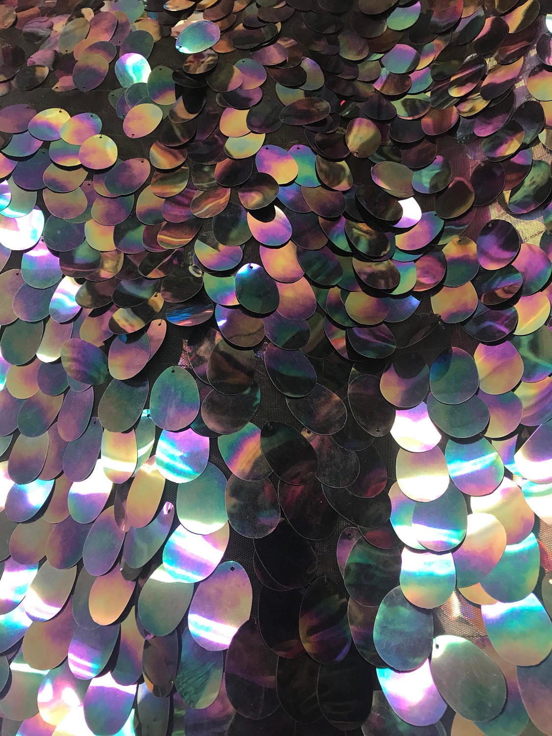 NEW iridescent jumbo size tear drop sequins on stretch mesh base 2 way stretch 56/57" Sold by the YD. Ships worldwide from Los Angeles CA