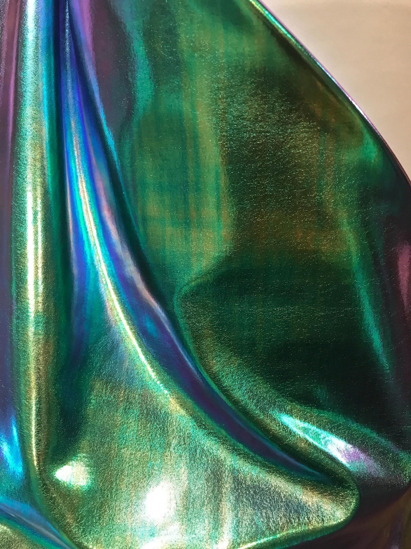 New Iridescent all over foil blue/green nylon spandex 4way Stretch 58/60" Sold by the YD. Ships worldwide from Los Angeles California USA