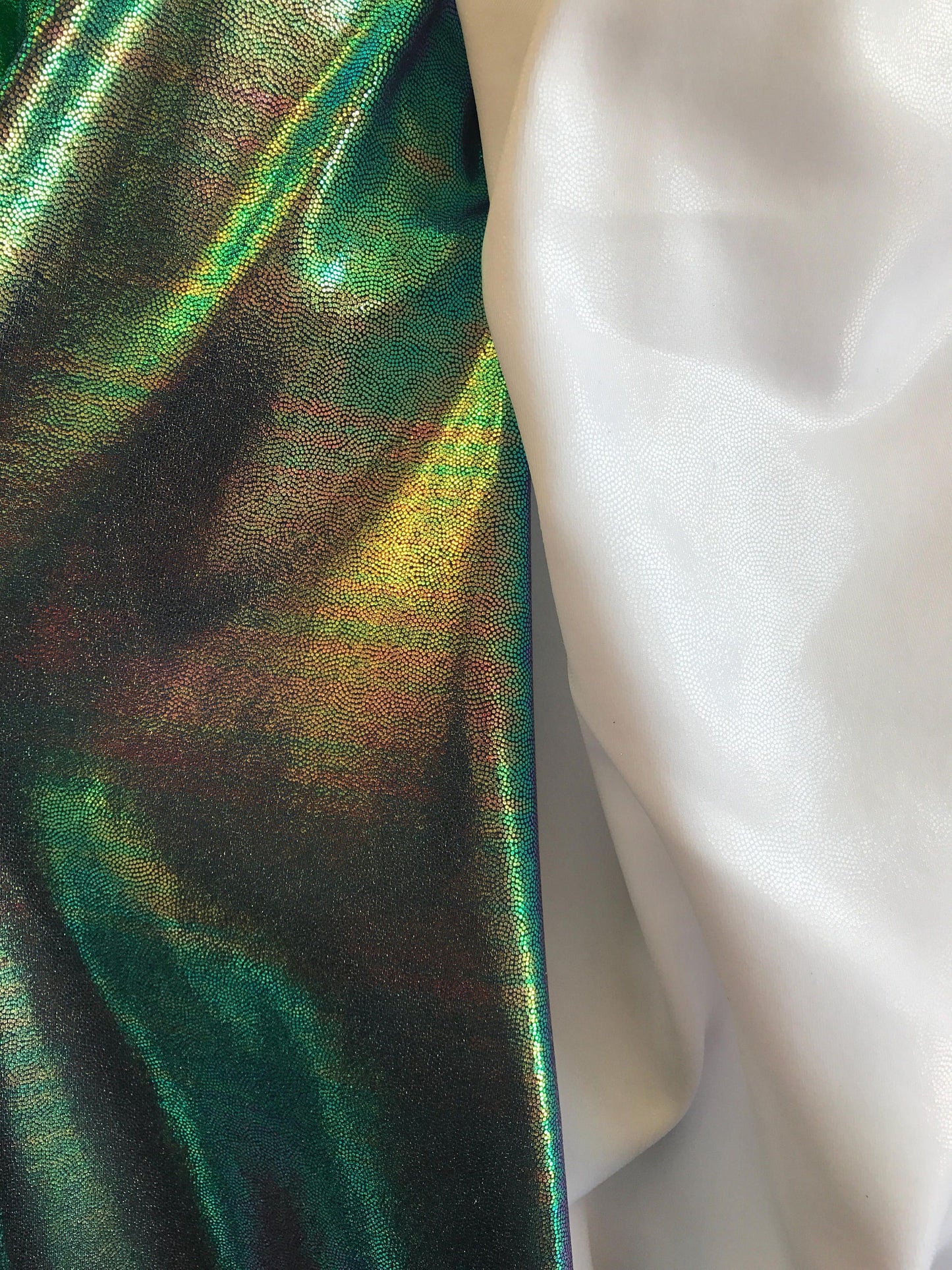 Foggy foil iridescent green & white clear metallic nylon spandex 4way 58/60" Sold by the YD. Ships worldwide from Los Angeles CA