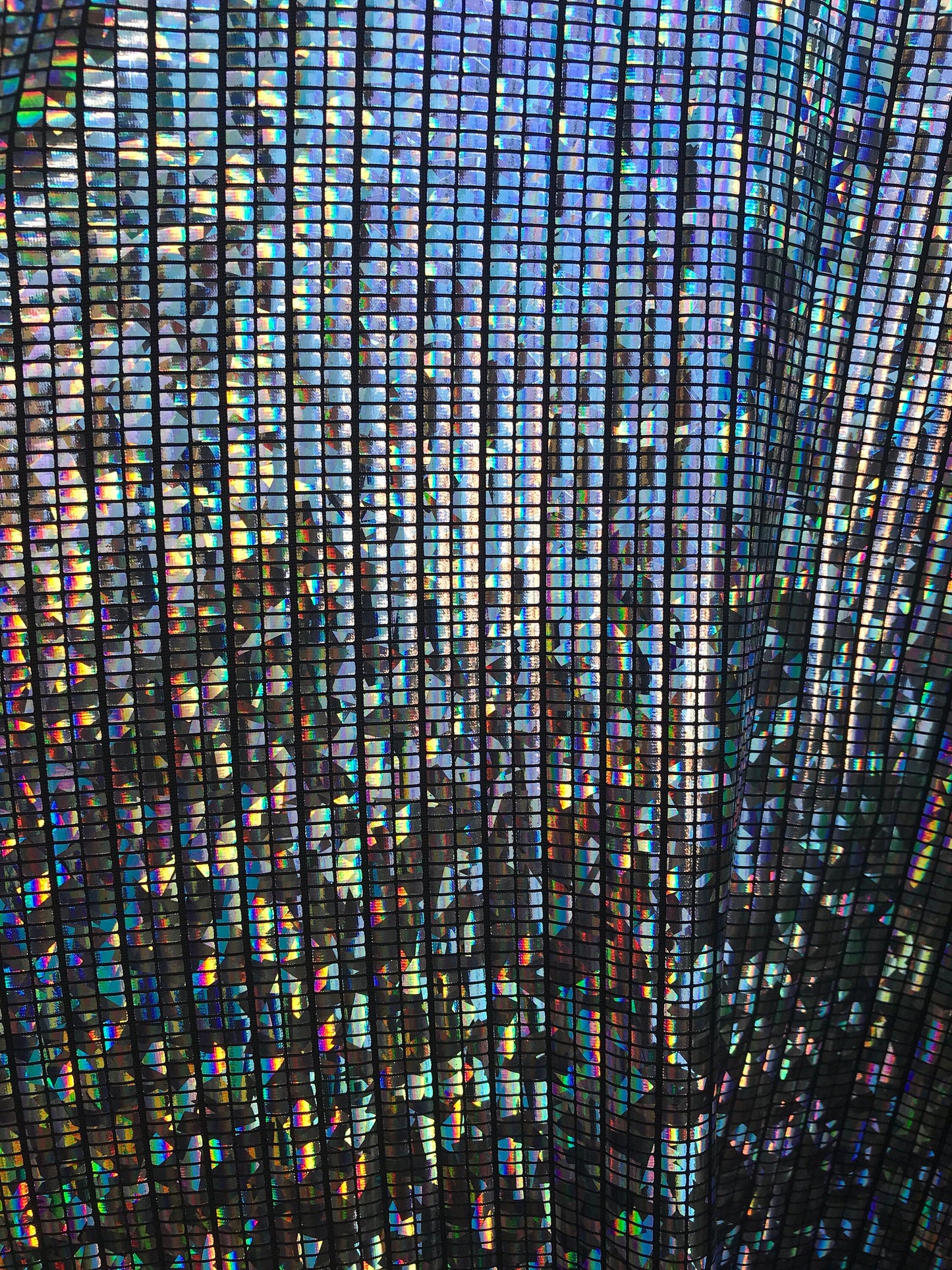 New metallic spandex mini rectangular hologram design 4way stretch 58/60" Sold by the YD. Ships worldwide from Los Angeles CA USA