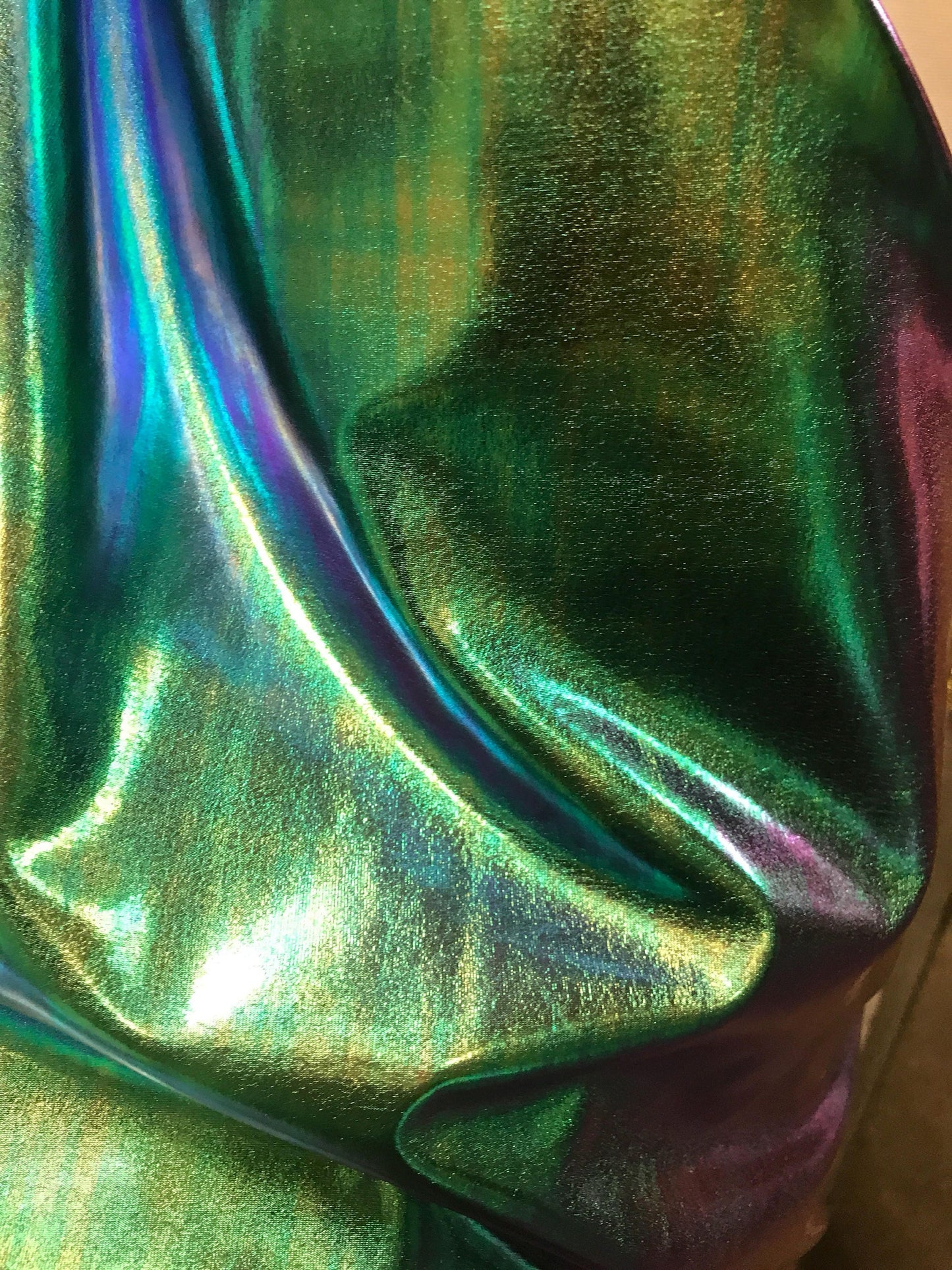 New Iridescent all over foil blue/green nylon spandex 4way Stretch 58/60" Sold by the YD. Ships worldwide from Los Angeles California USA