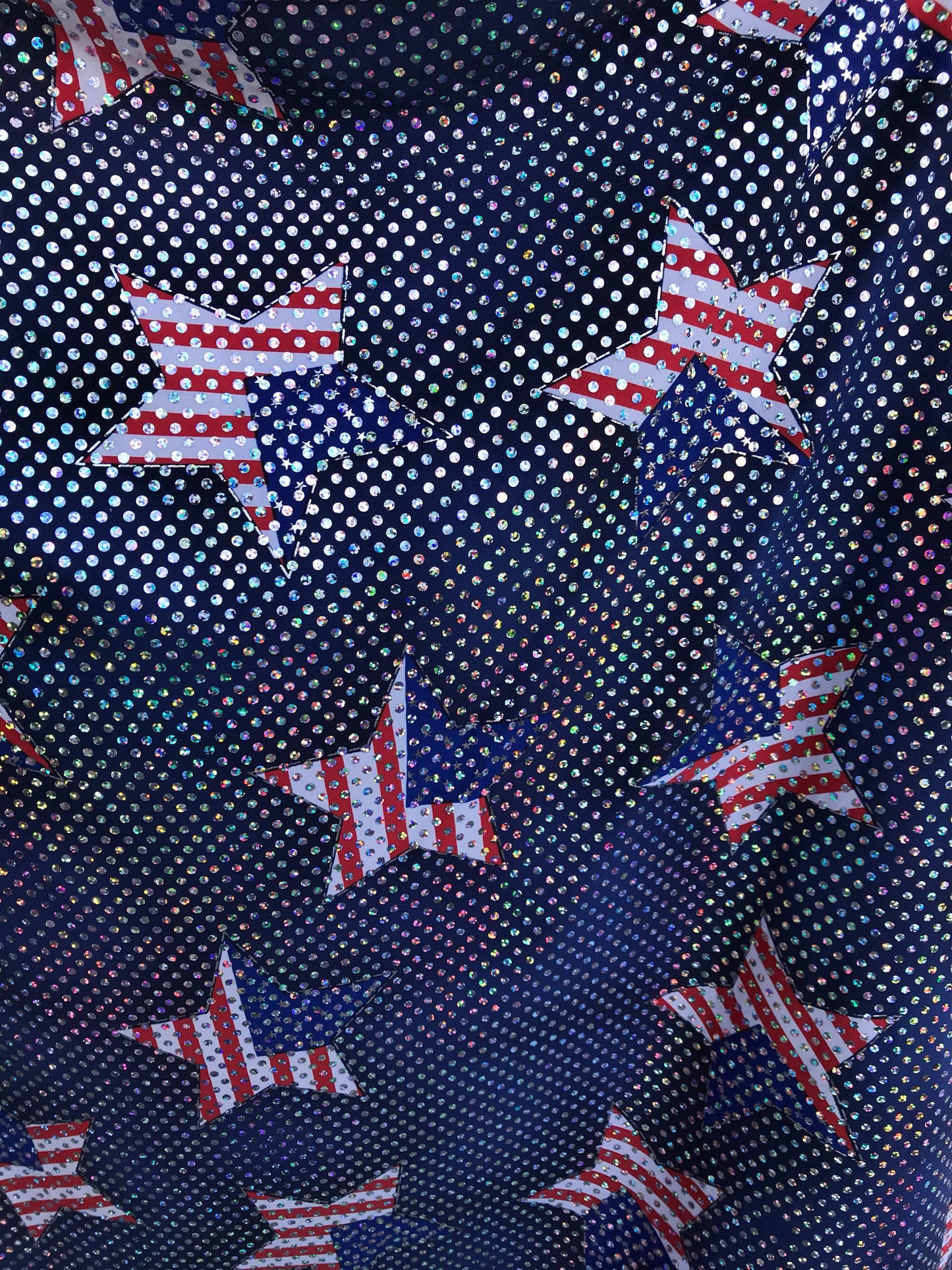 New American star design spandex fabric 4way stretch with hologram silver sequins all over 50" Sold by the YD. Ships worldwide from L.A CA