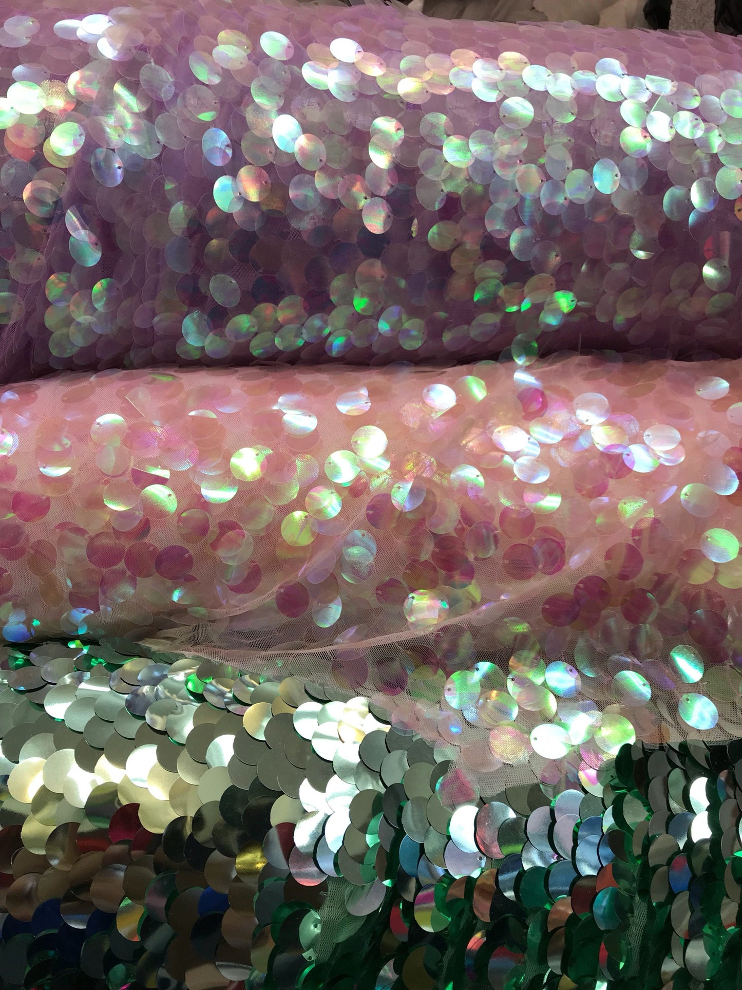 Iridescent sequins paillette design 20mm sequins size mesh base 58/60" 2way stretch. Sold bu the YD. Ships worldwide from Los Angeles CA