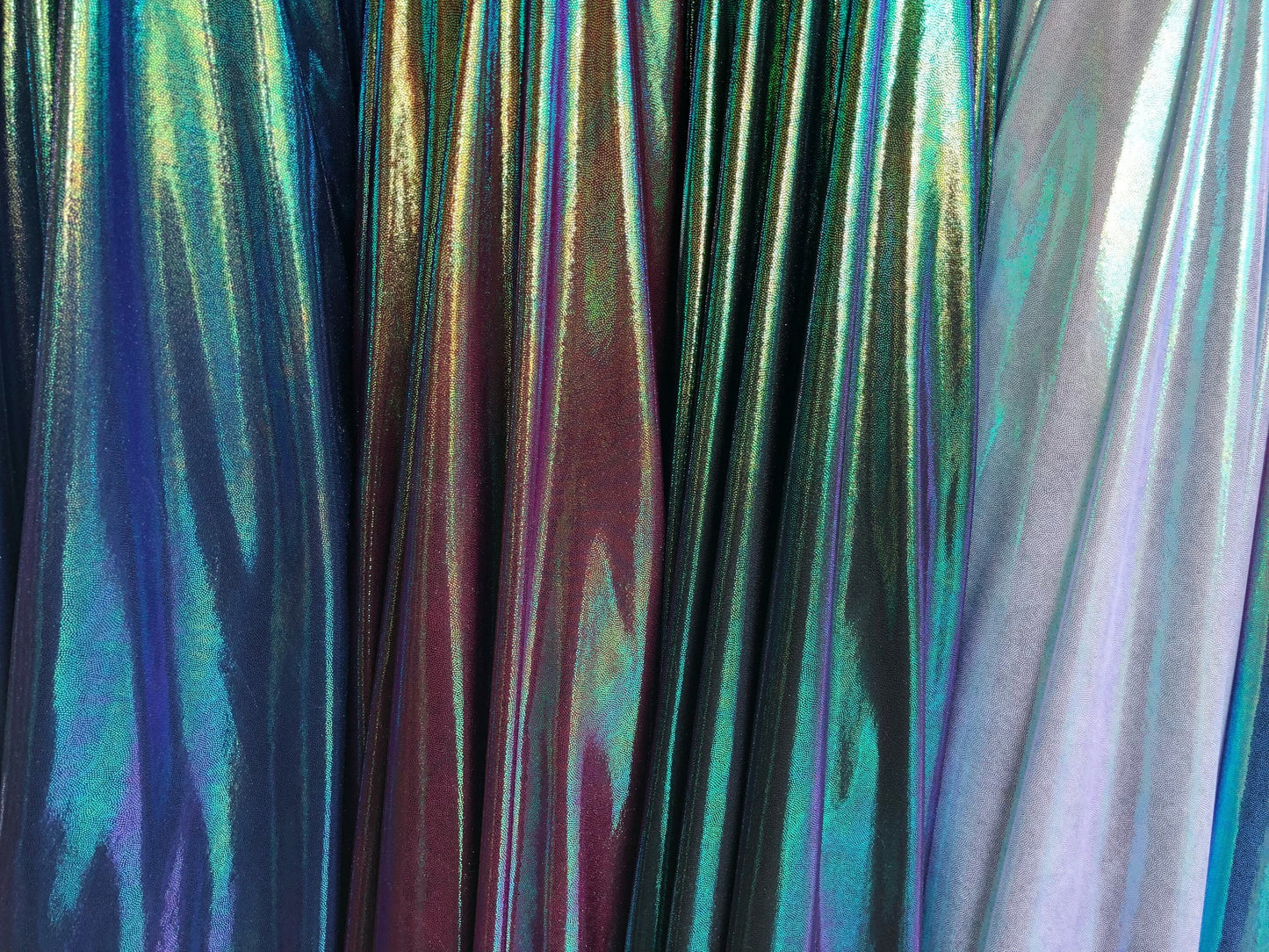 New iridescent foggy foil on nylon spandex 4way stretch 58/60" Sold by the YD. Ships worldwide from Los Angeles California USA