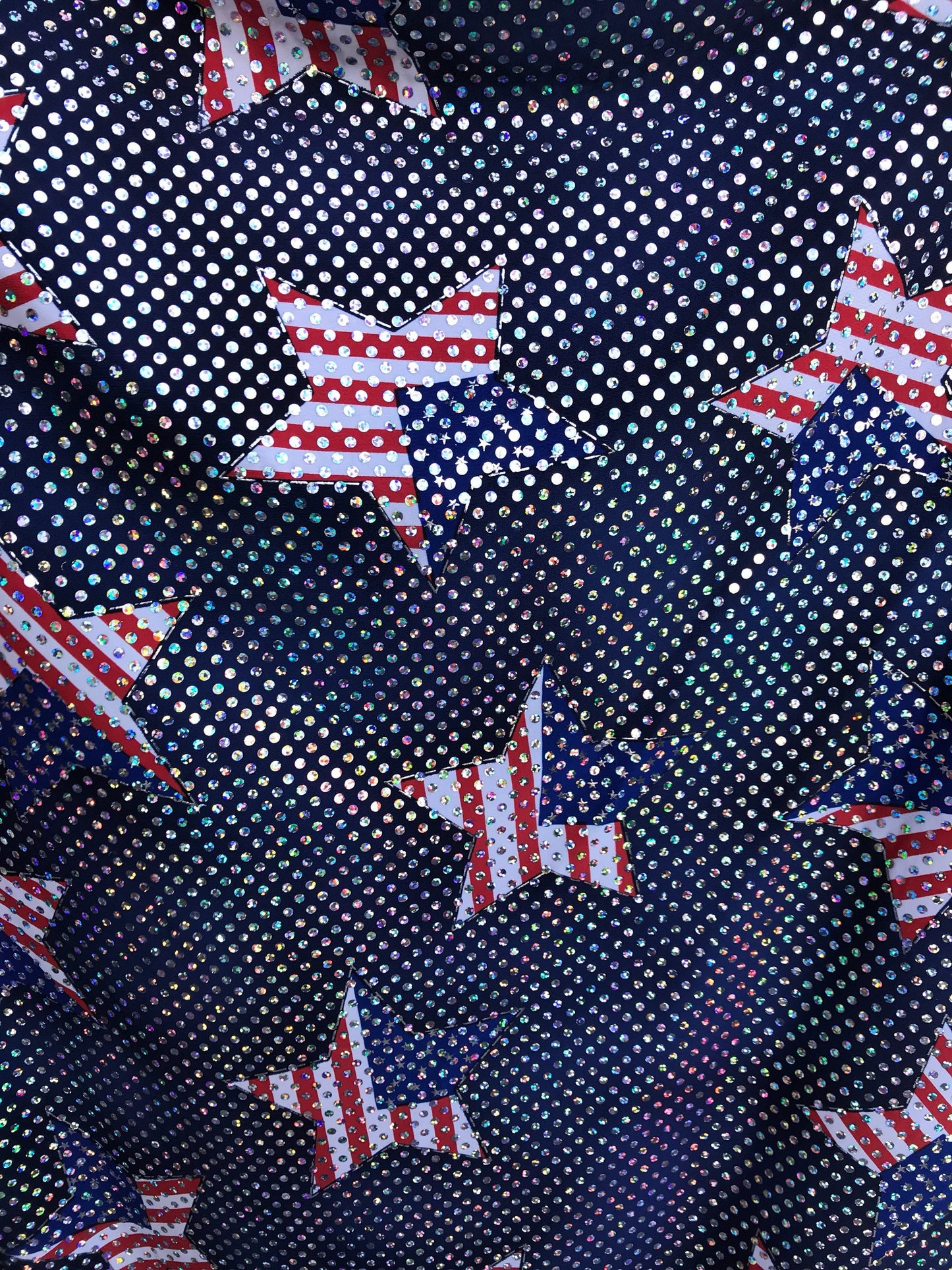 New American star design spandex fabric 4way stretch with hologram silver sequins all over 50" Sold by the YD. Ships worldwide from L.A CA