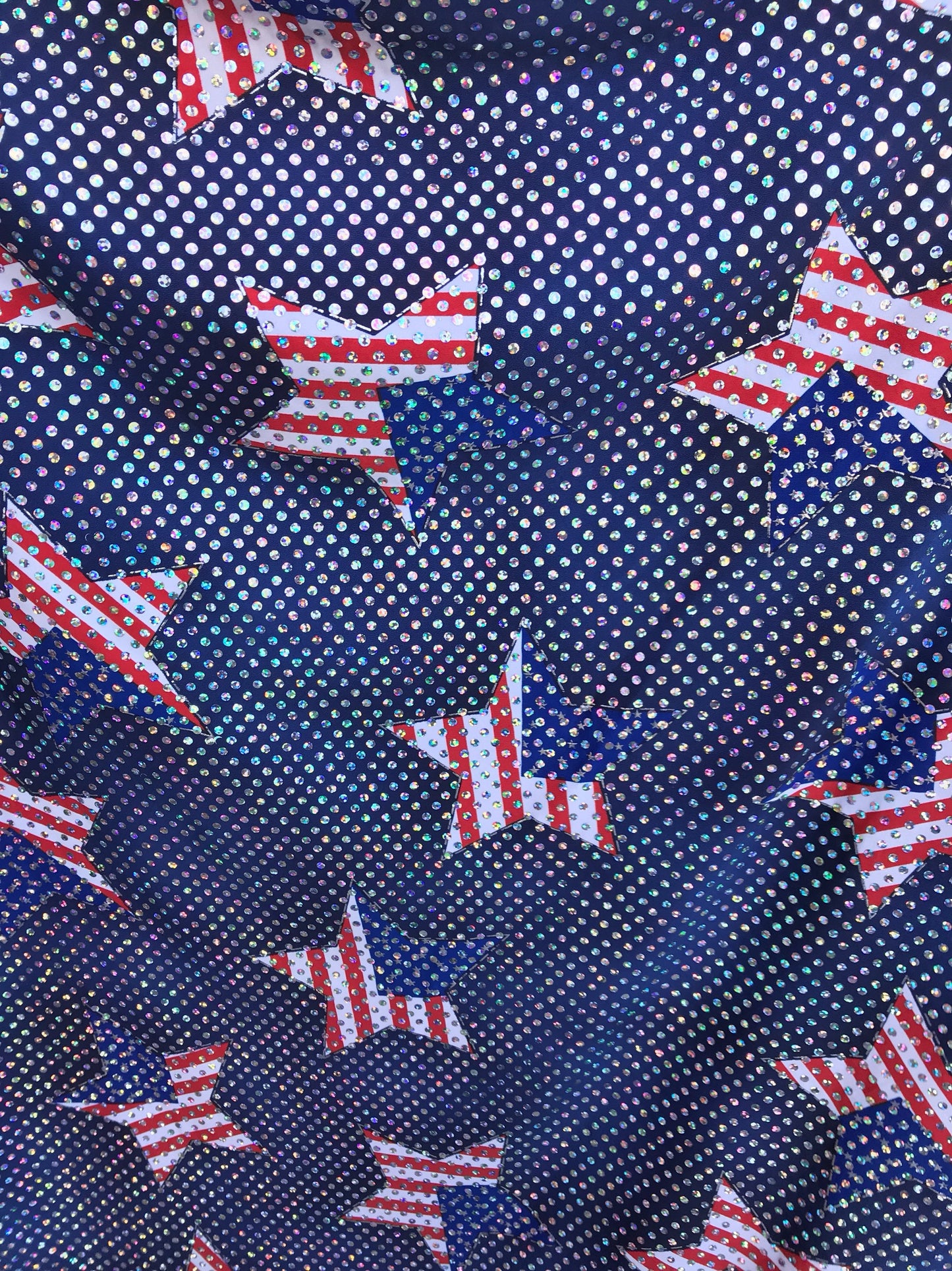 New American star design spandex fabric 4way stretch with hologram silver sequins all over 50" Sold by the YD. Ships worldwide from L.A CA