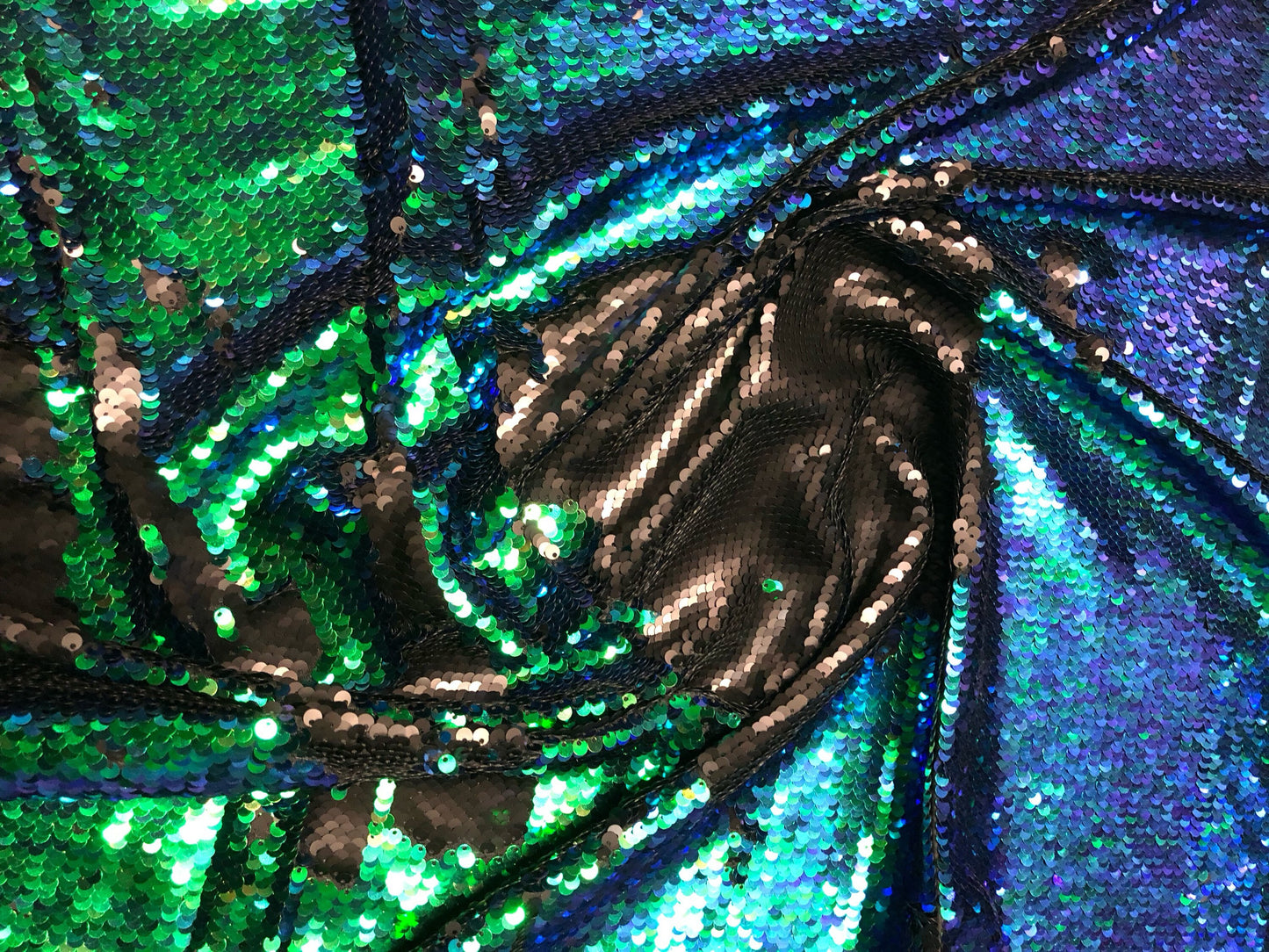 New flip up sequins reversible sequins green/black spandex base 2way strech 58/60" Sold by the YD. Ships worldwide from Los Angeles CA USA