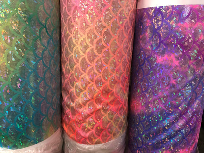 New tie dye mermaid design nylon spandex with hologram foil 4way Stretch 58/60" Sold by the YD. Ships worldwide from Los Angeles CA USA.