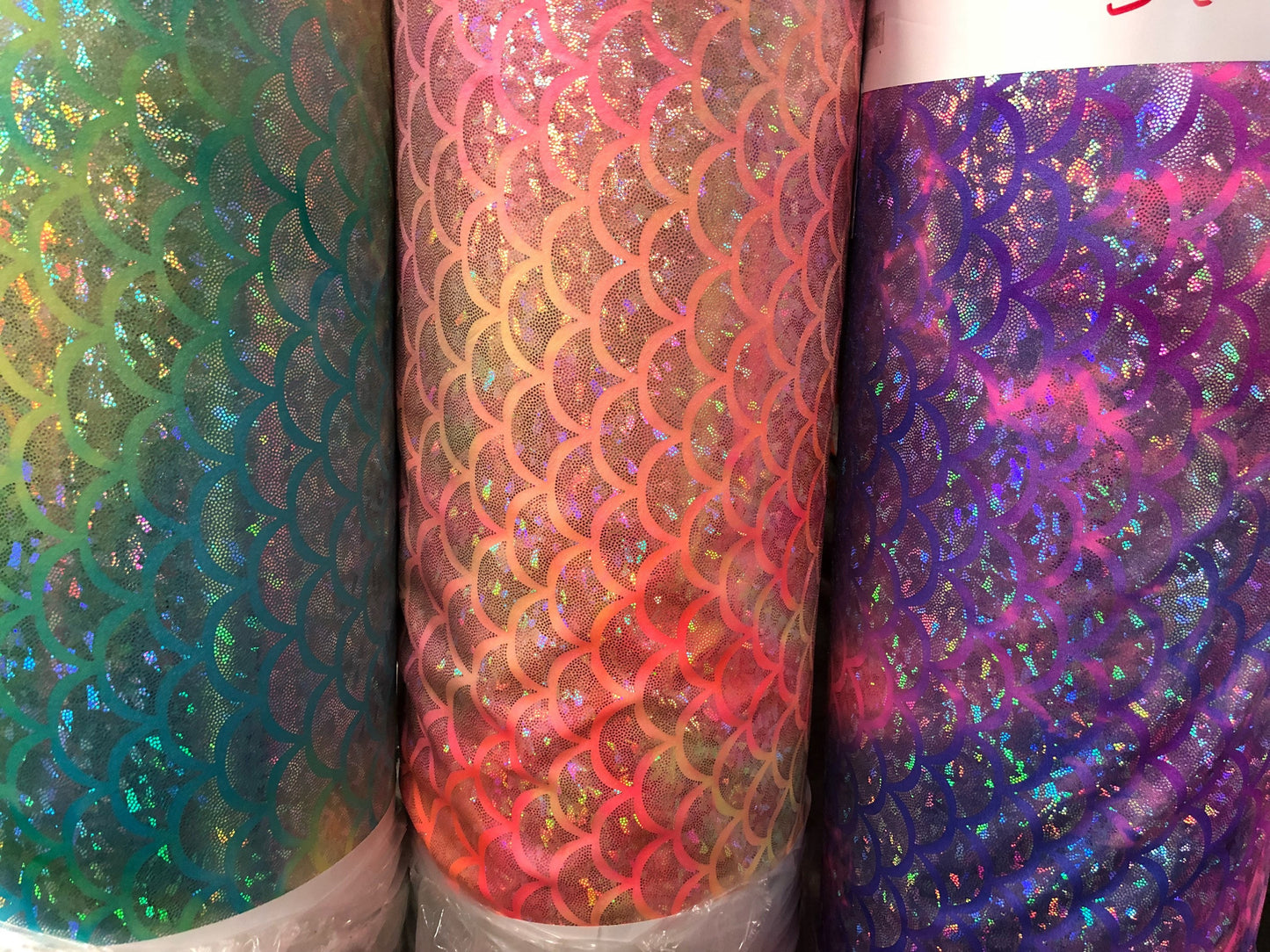 New tie dye mermaid design nylon spandex with hologram foil 4way Stretch 58/60" Sold by the YD. Ships worldwide from Los Angeles CA USA.