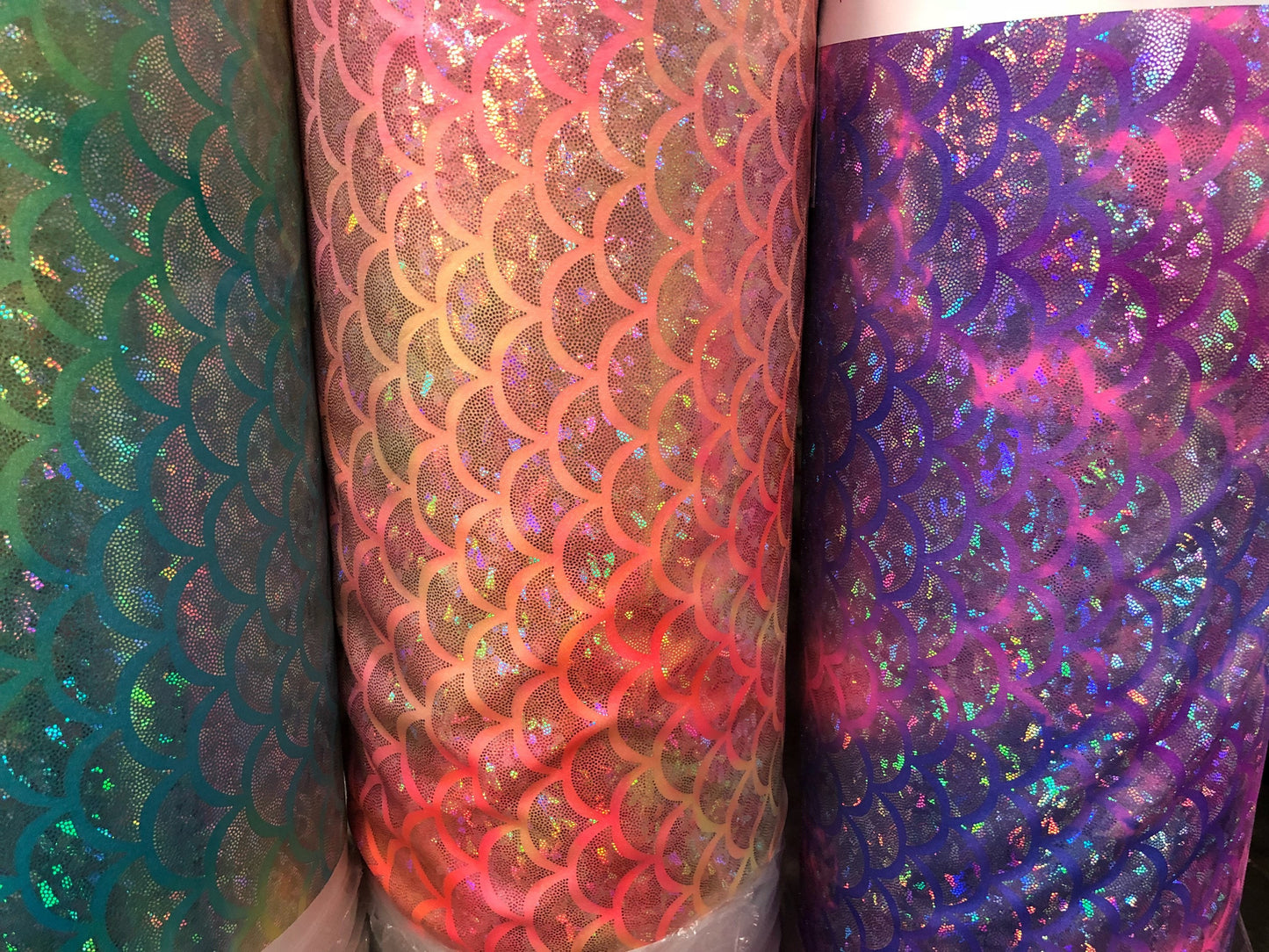 New tie dye mermaid design nylon spandex with hologram foil 4way Stretch 58/60" Sold by the YD. Ships worldwide from Los Angeles CA USA.