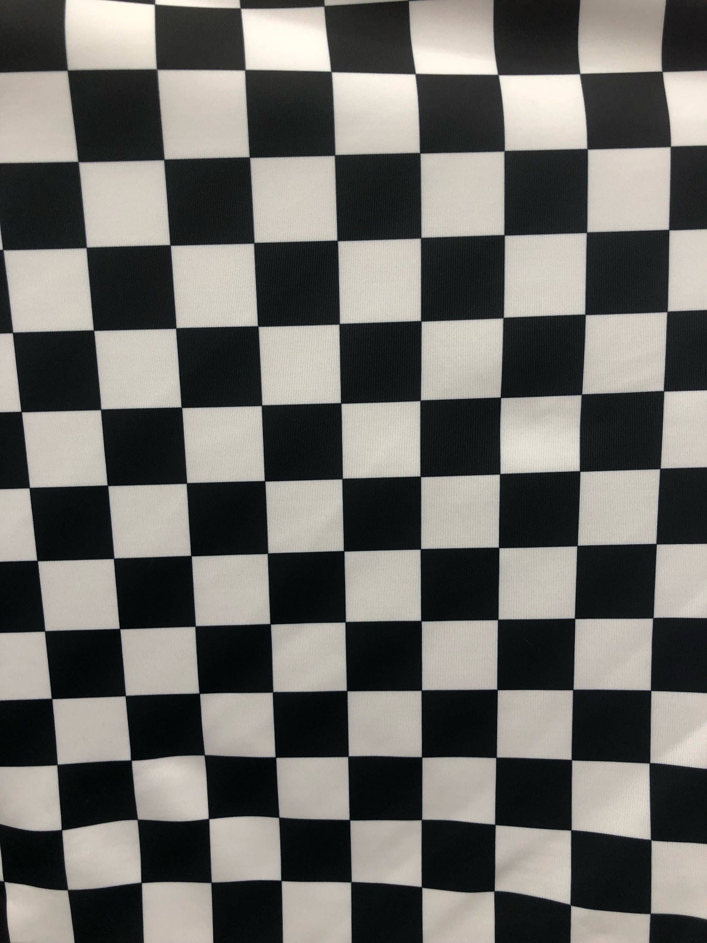 Checkered design 1" print on nylon spandex 4way stretch 58/60" Sold by the YD. Ships worldwide from Los Angeles California USA