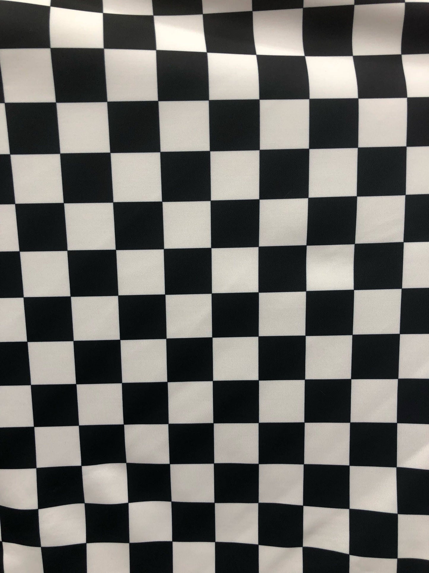 Checkered design 1" print on nylon spandex 4way stretch 58/60" Sold by the YD. Ships worldwide from Los Angeles California USA