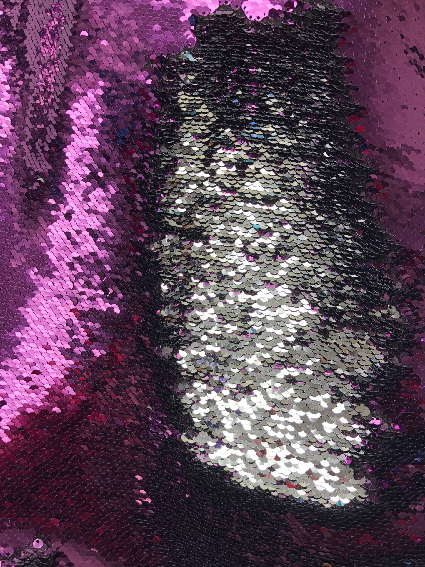 Flip up sequins eggplant/silver reversible sequins in spandex base 58/60" Sold by the YD. Ships worldwide from Los Angeles California USA.