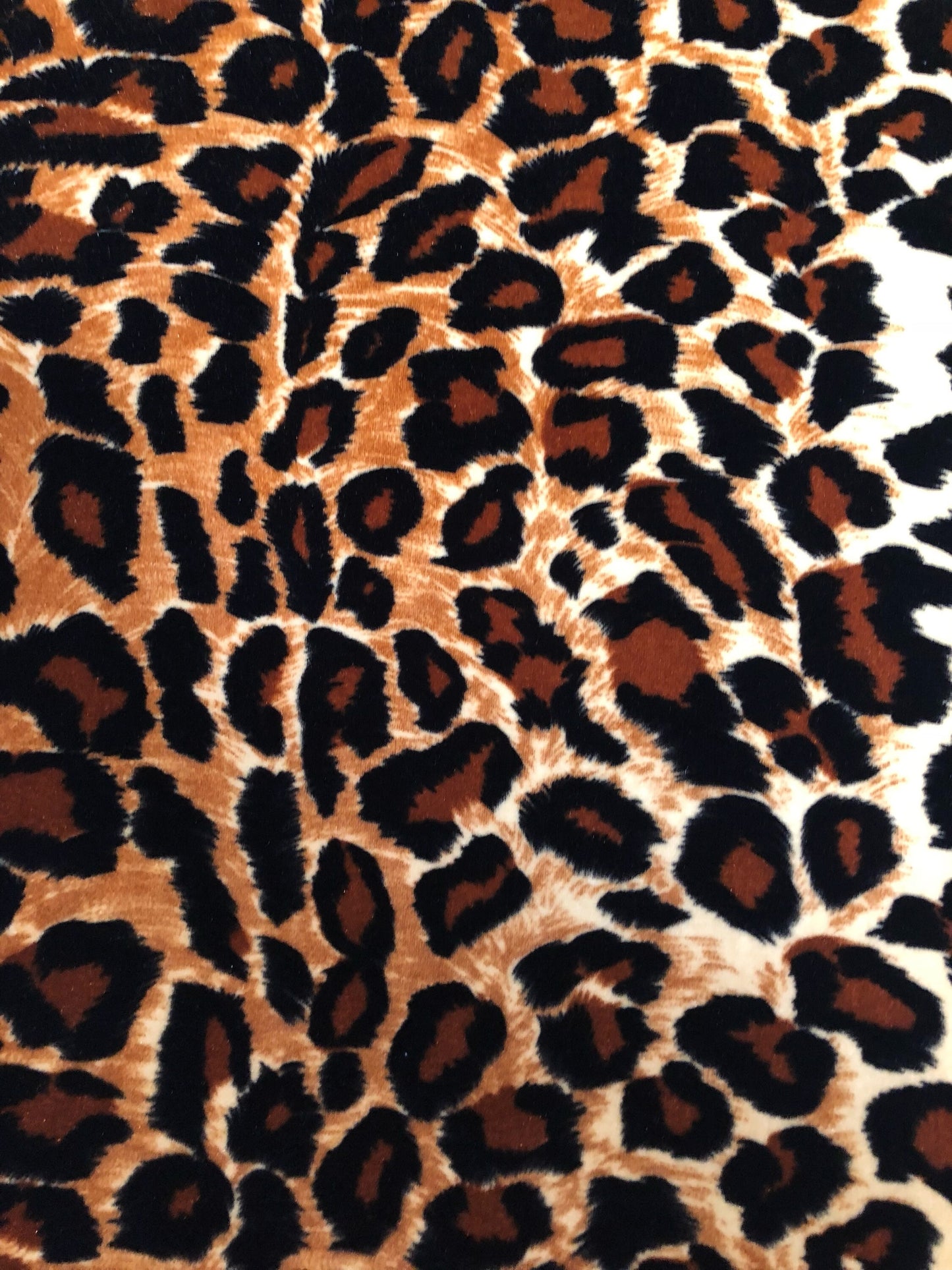 New leopard print Brown/Gold on heavy stretch velvet 4way stretch 58/60" Sold by the YD. Ships worldwide from Los Ángeles California USA.