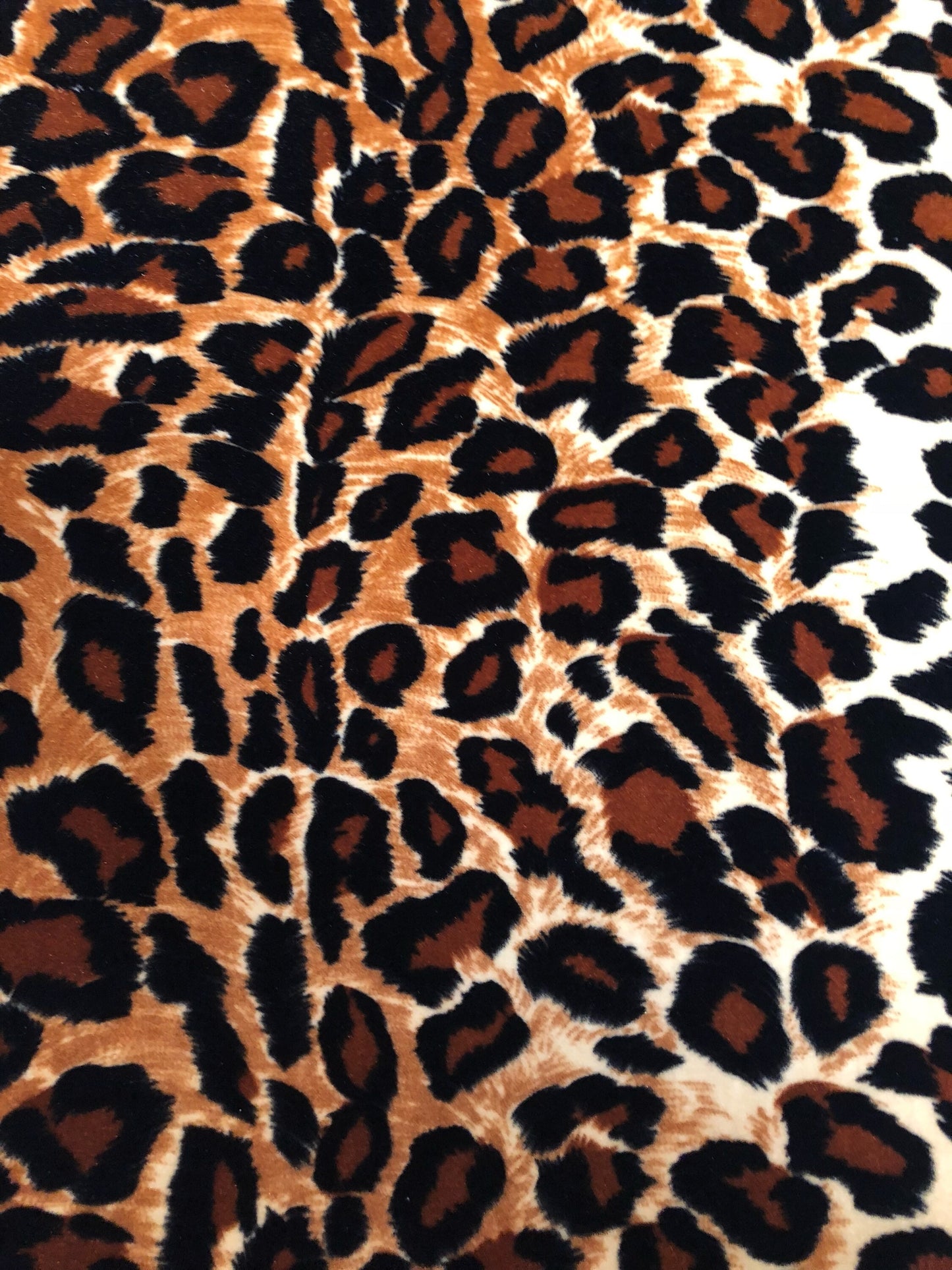 New leopard print Brown/Gold on heavy stretch velvet 4way stretch 58/60" Sold by the YD. Ships worldwide from Los Ángeles California USA.