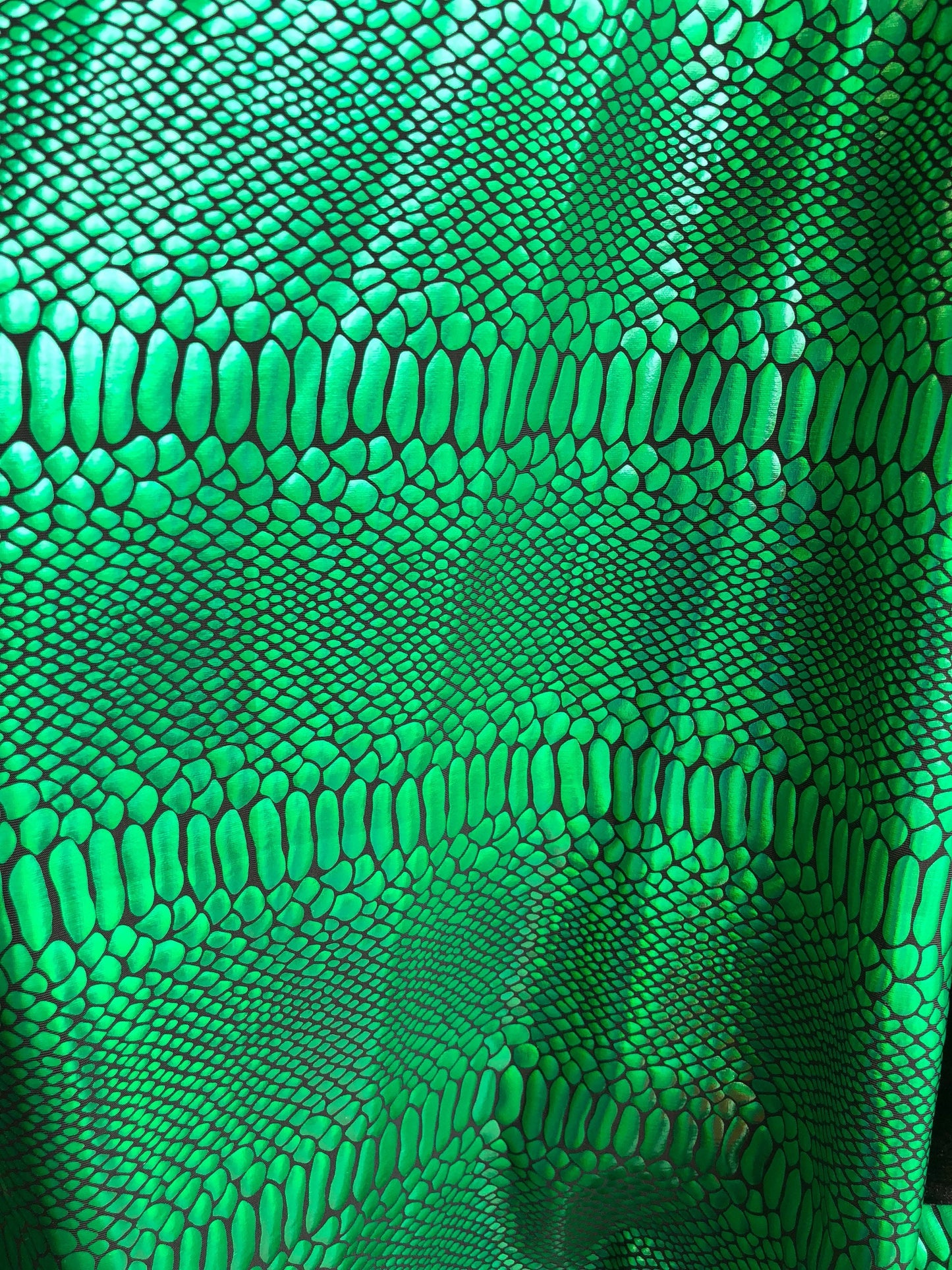 New metallic spandex crocodile design balck/green 4way Stretch 58/60" Sold by the YD. Ships worldwide from Los Angeles California USA.